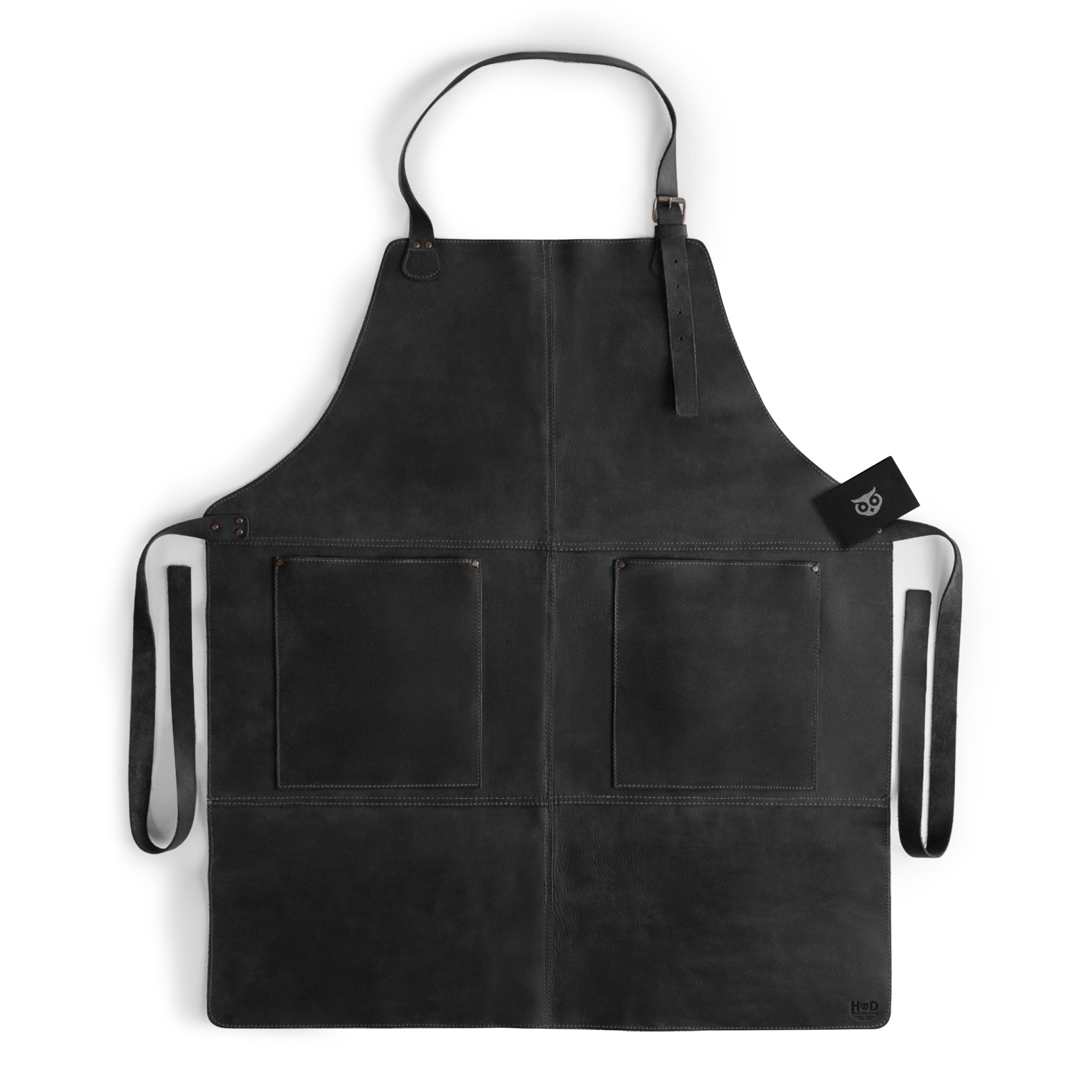 Hide & Drink Leather Apron in black showcasing its rustic charm and practical design, perfect for carrying tools with large pockets. A handcrafted Leather Apron made from premium full grain leather.