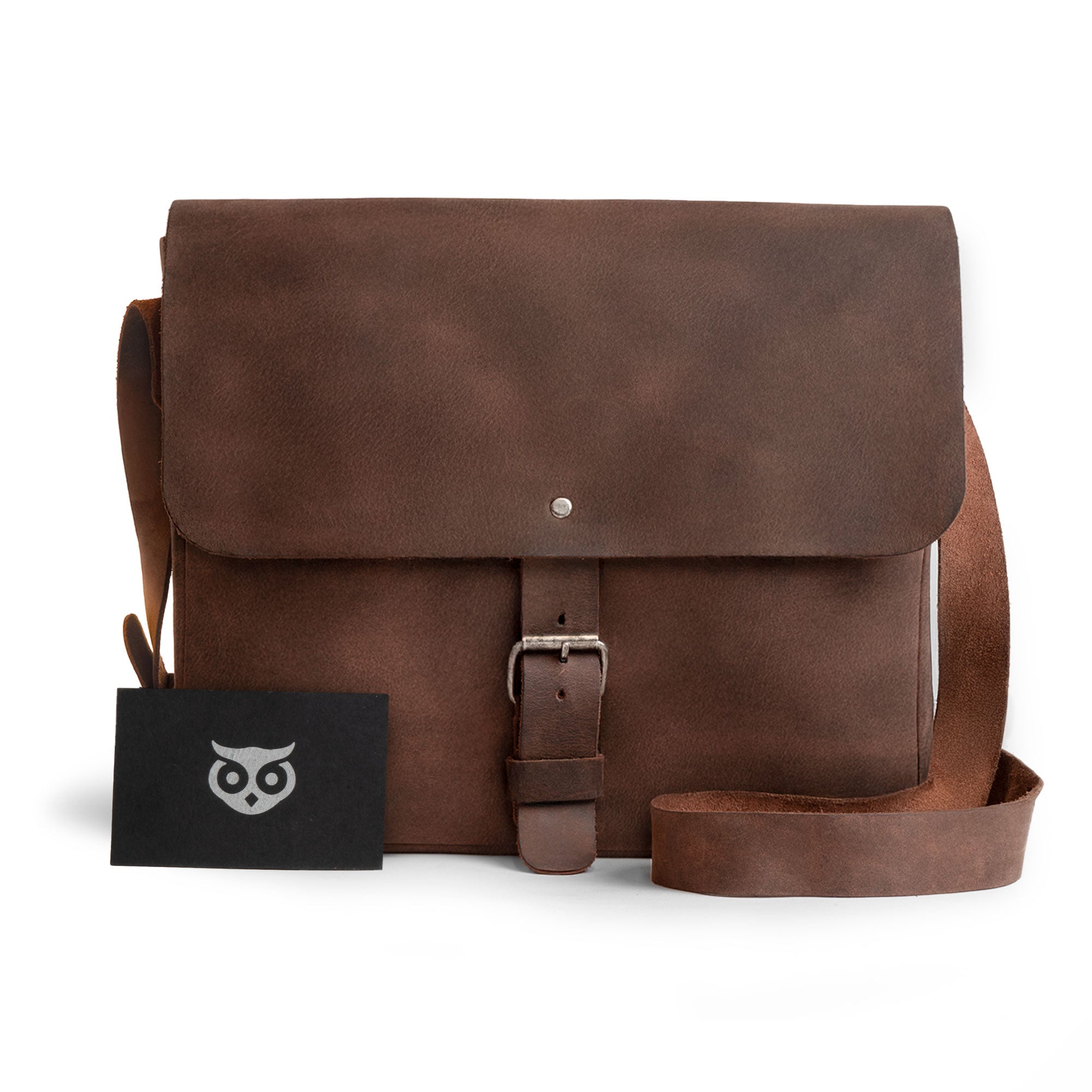 Hide & Drink’s Small Messenger Bag with tags, revealing its craftsmanship and origin. Made from high-quality Full Grain Leather, this durable crossbody bag represents a perfect travel accessory, artfully hand cut and sewn by artisans in La Antigua Guatemala & Oaxaca Mexico.