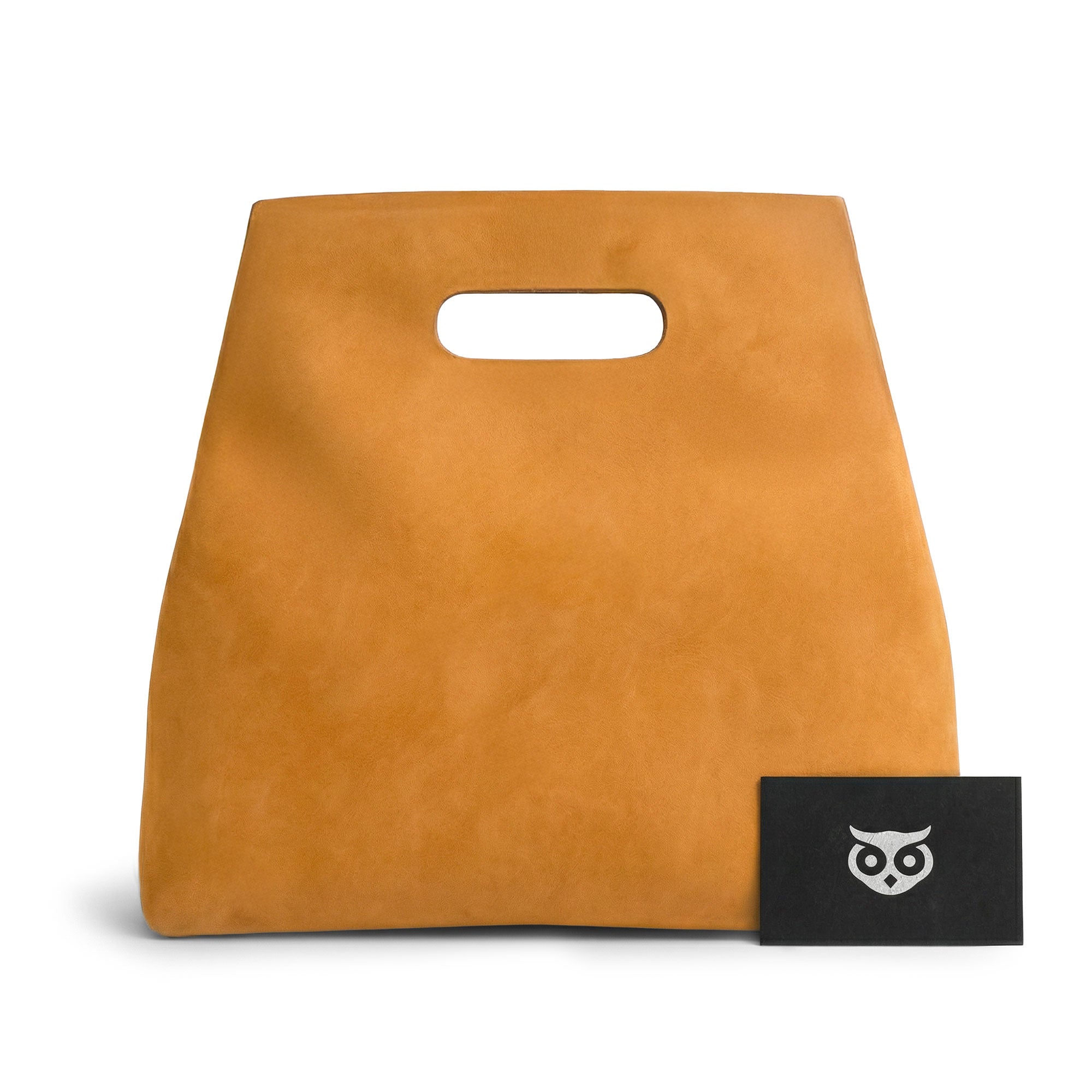 Close up of the Minimalist Boho Handbag by Hide & Drink showcasing the logo and craftsmanship. This chic Minimalist Handbag for Women serves as a Rustic Purse and Tote Bag, made from quality Full Grain Leather. Handmade in La Antigua Guatemala & Oaxaca Mexico, it features fire branding and artisanal skills reflecting small batch production.