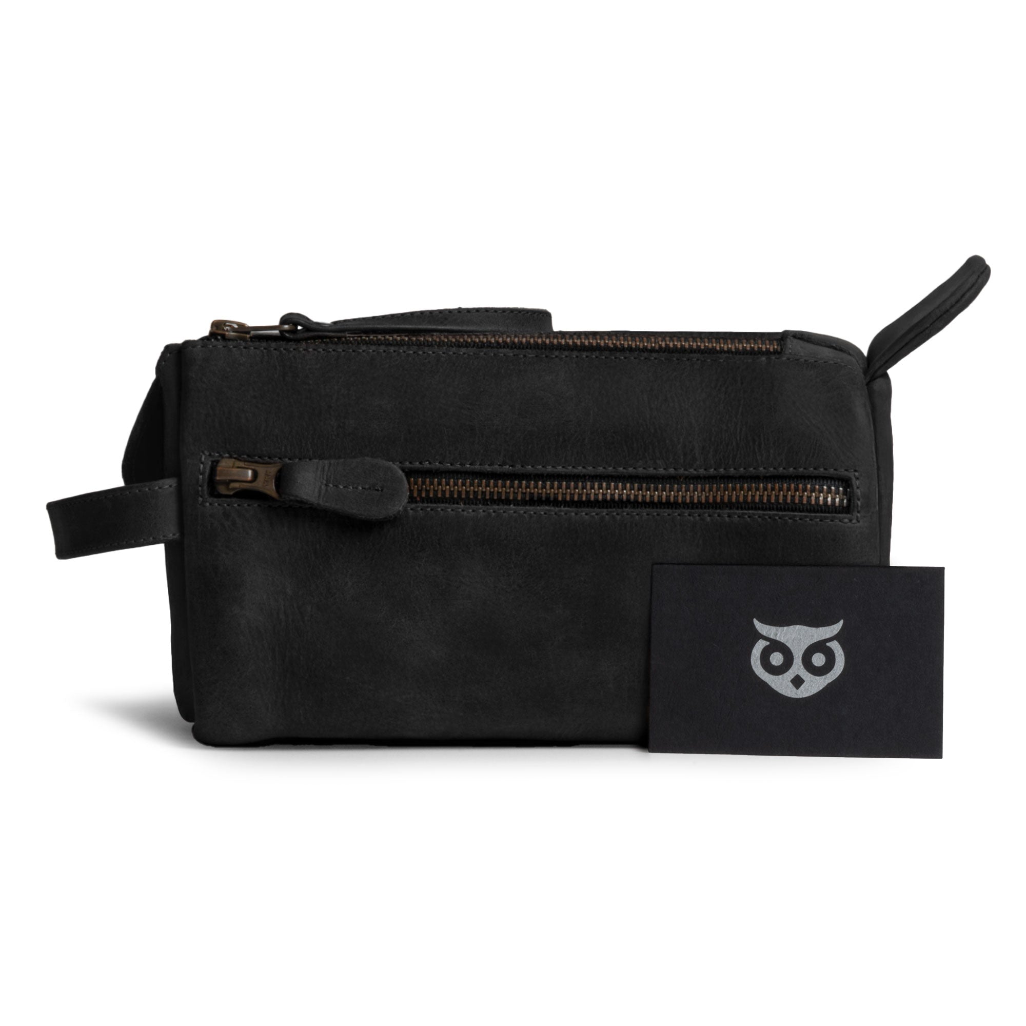 Hide & Drink's Toiletry Bag care card displayed alongside the item. This Full Grain Leather Toiletry Bag is perfect as a Hand Bag or Dopp Kit Organizer for essential travel items. StockyardX, Handmade, S.