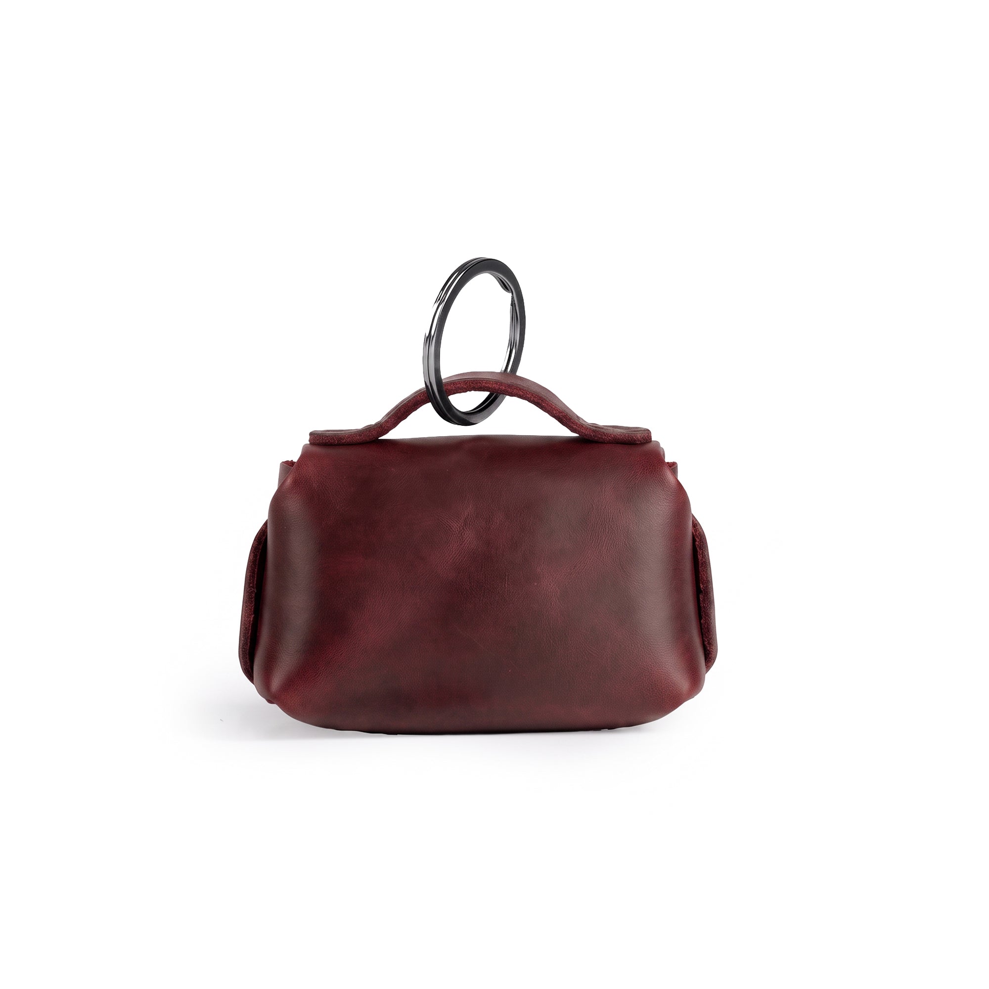 Back view of the Tiny Handbag Keychain by Hide & Drink, highlighting its unique Full Grain Leather texture and key ring holder. A true testament to artisan craftsmanship from La Antigua Guatemala, this keychain is both stylish and functional.