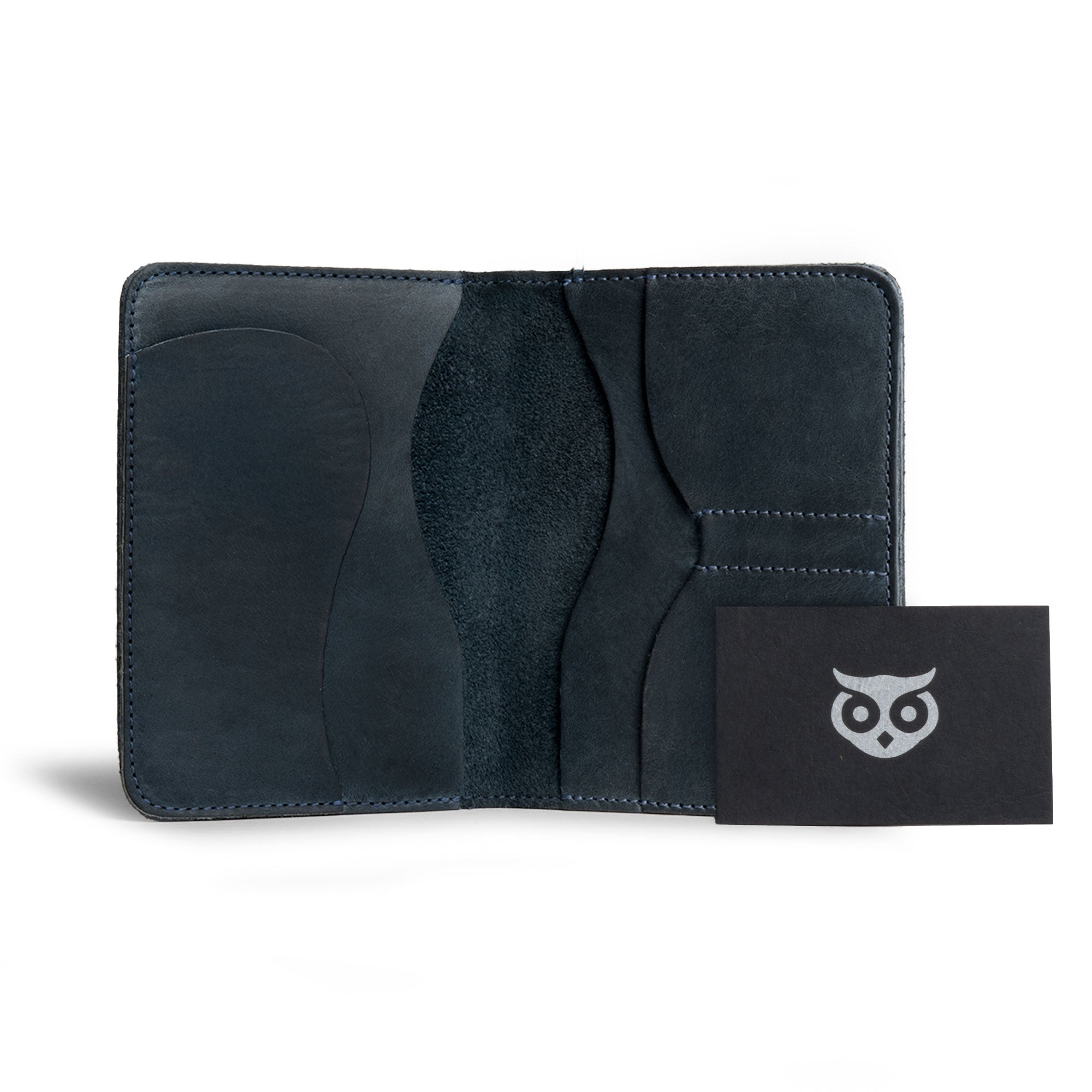 Dimensions of Hide & Drink's navy Double Passport Wallet W/Key Slot, illustrated alongside a passport, designed for organizing travel essentials, handcrafted by artisans in La Antigua Guatemala & Oaxaca Mexico.