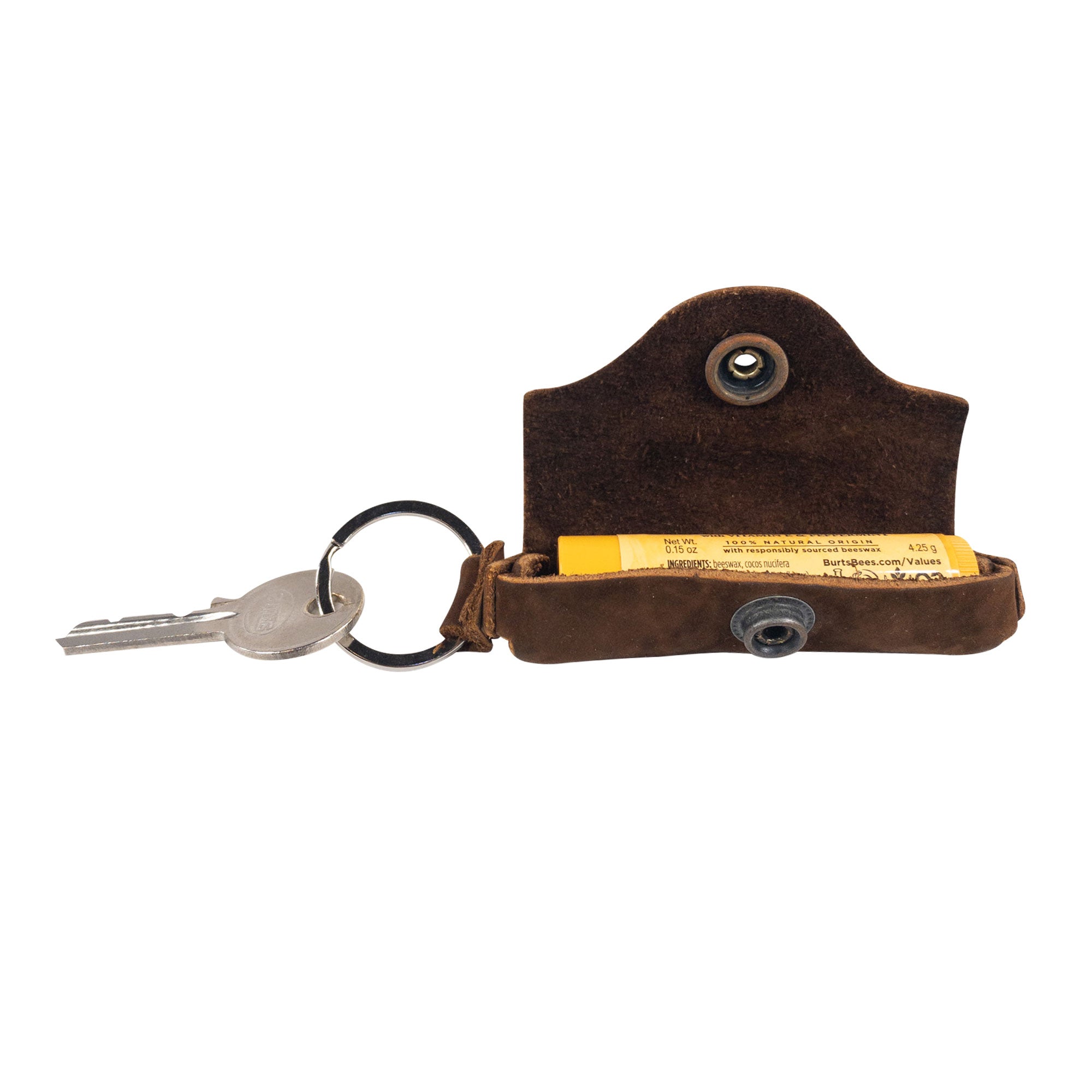 The Hide & Drink Lip Balm Key Chain features a unique design, ideal for securing your favorite lip balm. This small batch production piece combines classic vintage style with functionality, featuring a brass metal clasp for easy access.