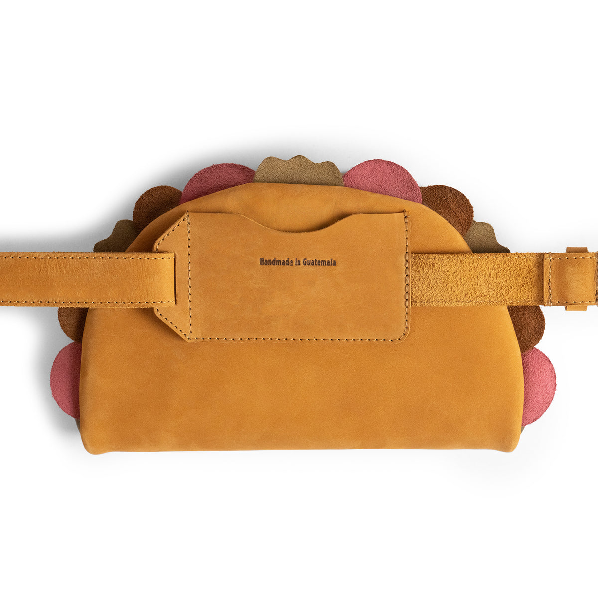 Top view of the Hide & Drink Taco Fanny Pack showing its tan full grain leather body, adjustable waist strap, rear pocket, and colorful taco-inspired trim. This waist bag combines fun belt bags character with a zippered bags design for use as a travel carrier, outdoor waist pouch, carry on case, and travel accessory. StockyardX creates it through small batch production using hand cut, hand sewn, fire branded artisan methods, handmade in La Antigua Guatemala & Oaxaca Mexico.