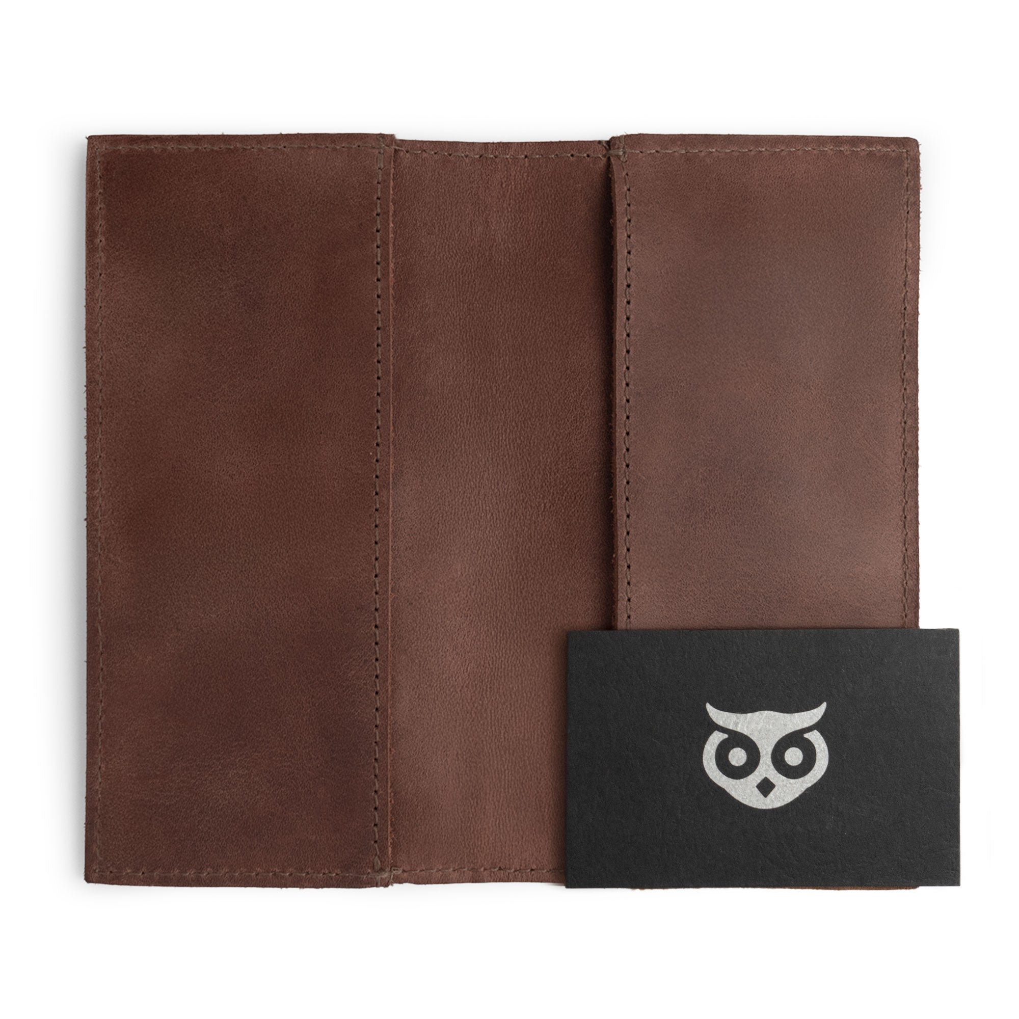 Inner view of the Checkbook Leather Cover by Hide & Drink, serving as a minimalist organizer suitable for standard checkbooks. This artisan product, made from full grain leather, is handmade in La Antigua Guatemala and Oaxaca Mexico, showcasing the skill involved in small batch production.