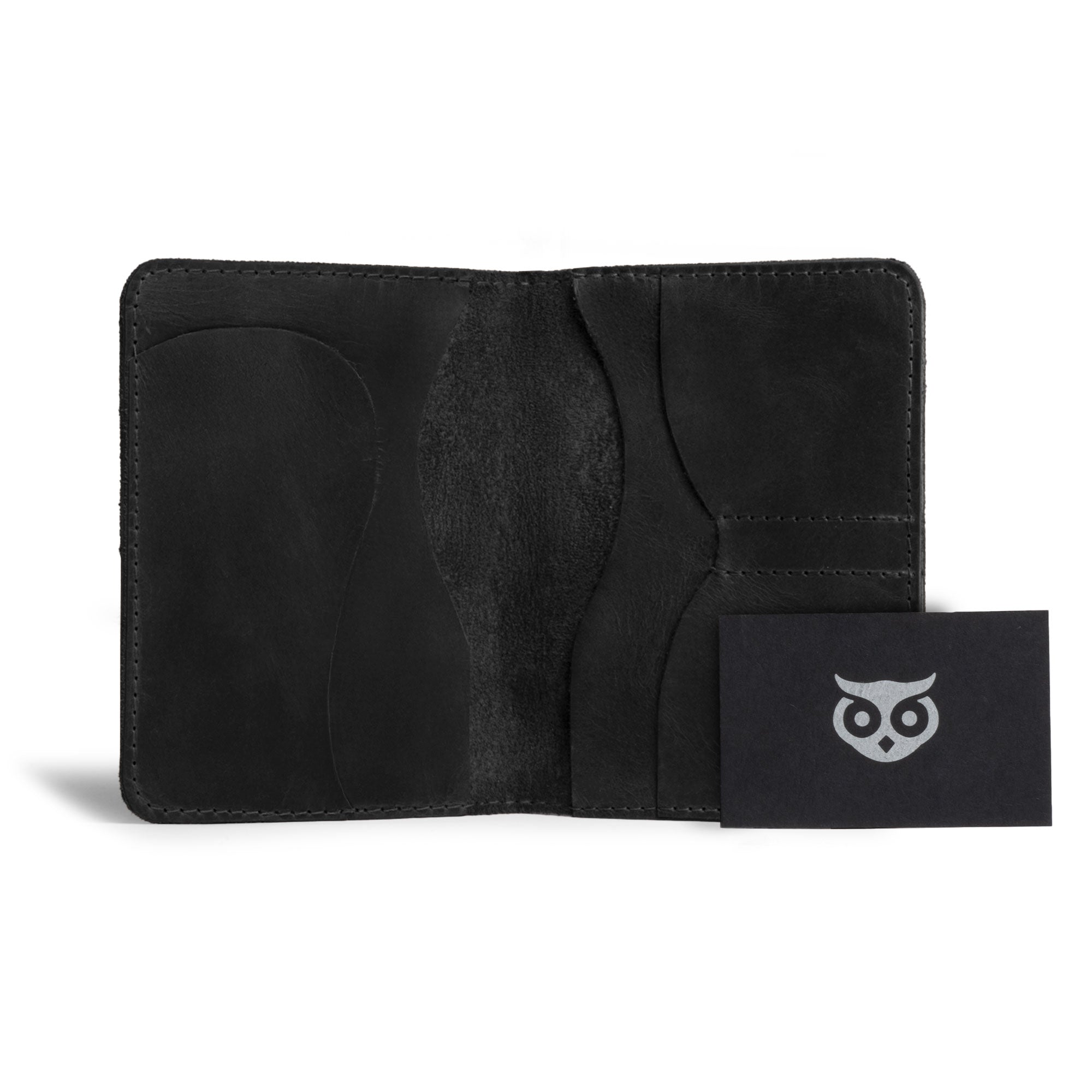 Interior of the black Hide & Drink Double Passport Wallet W/Key Slot, spotlighting the quality of the handmade full grain leather, built with organized slots for your travel needs from artisan creators.