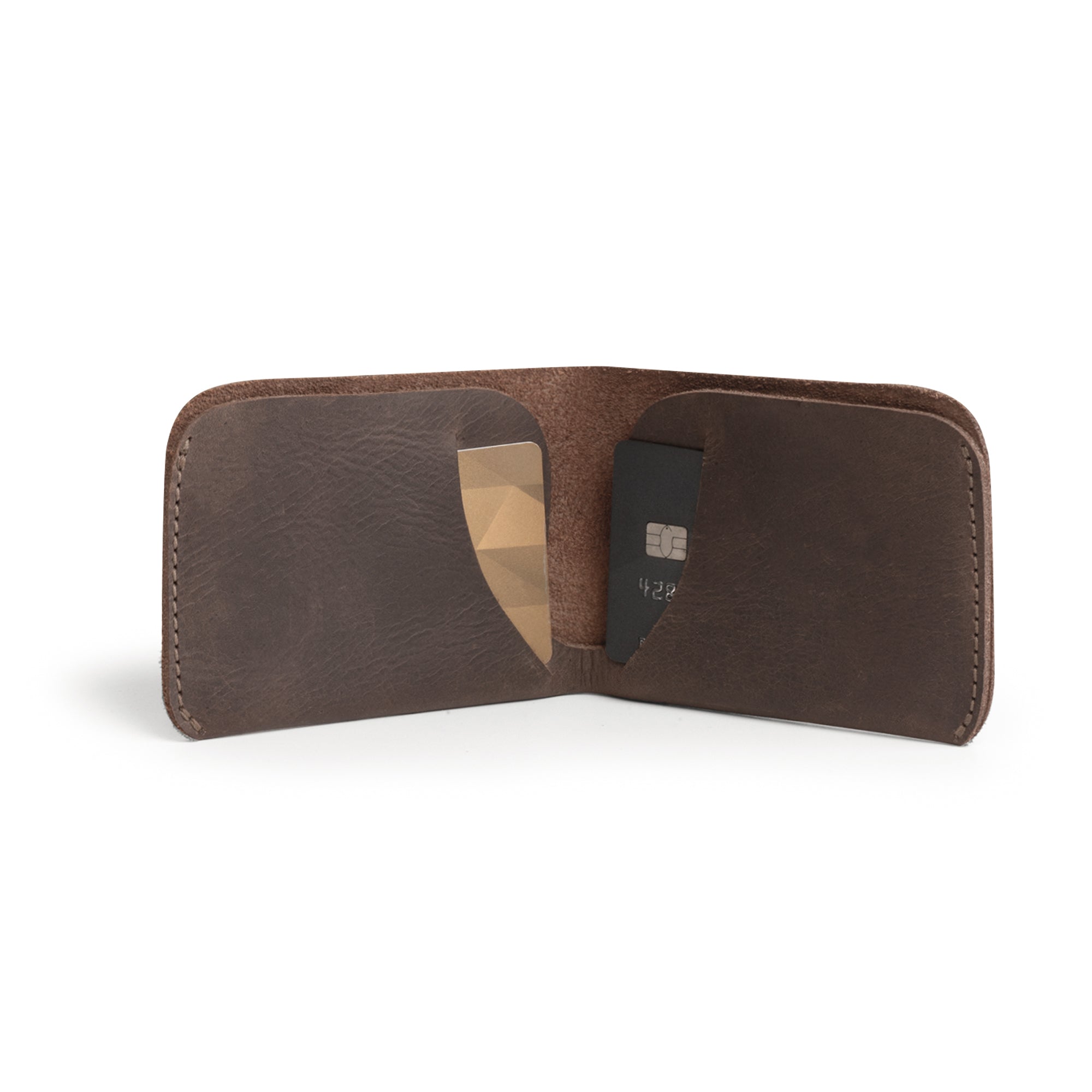 Inside view of the Hide & Drink Minimal Wallet showcasing space for cards and cash, made from Full Grain Leather. This Classic Slimfold Wallet serves as a stylish Card Organizer Holder and essential Travel Accessory. Hand Cut, Hand Sewn, and Fire Branded, it’s an Artisan, Handmade piece produced in La Antigua Guatemala & Oaxaca Mexico.