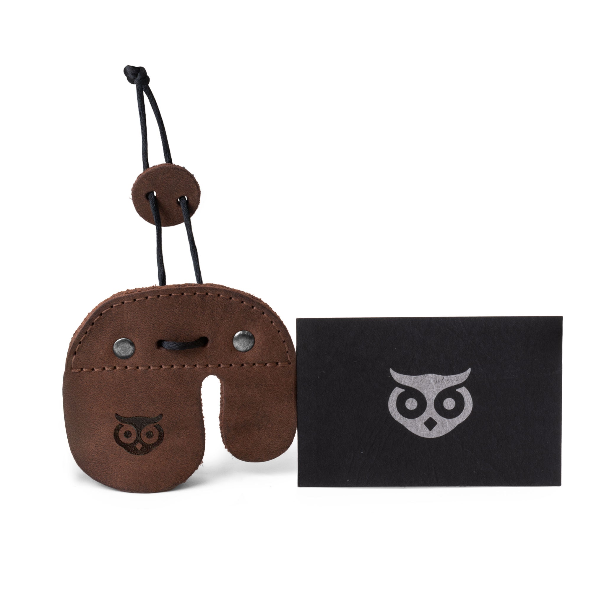 Hide & Drink Left Handed Archery Finger Protector alongside an artisan care card. This Archery Finger Tab is your Protect Guard for Recurve Bows, made from stylish Full Grain Leather. Tailored for shooting practice gear, this finger protector features small batch production quality from StockyardX, blending functionality with artisan craftsmanship.