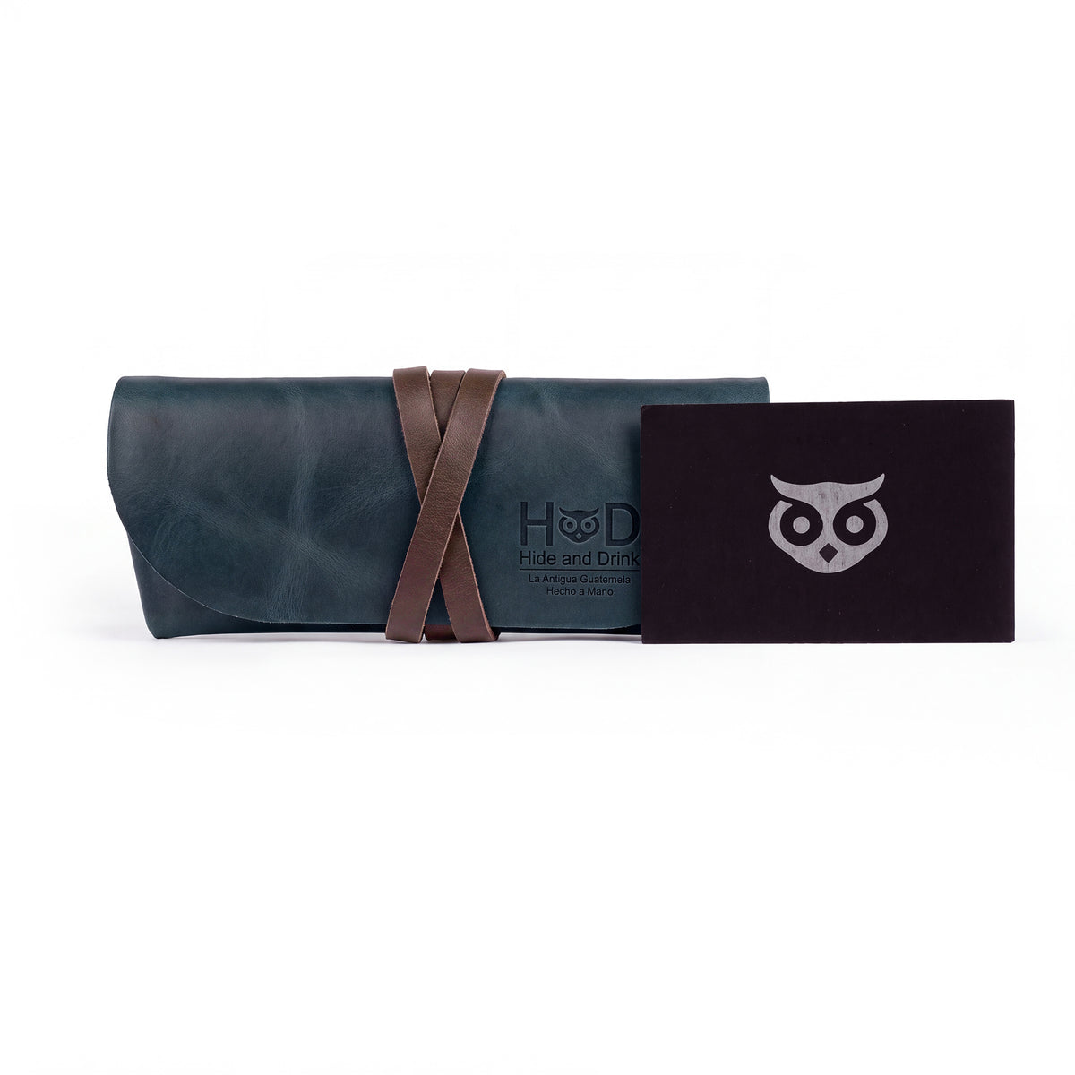Hide & Drink Leather Sunglass Wrap is a chic accessory for storing your sunglasses securely. Made from full grain leather, it serves as an eye glasses storage solution perfect for travel, showcasing artisan quality.