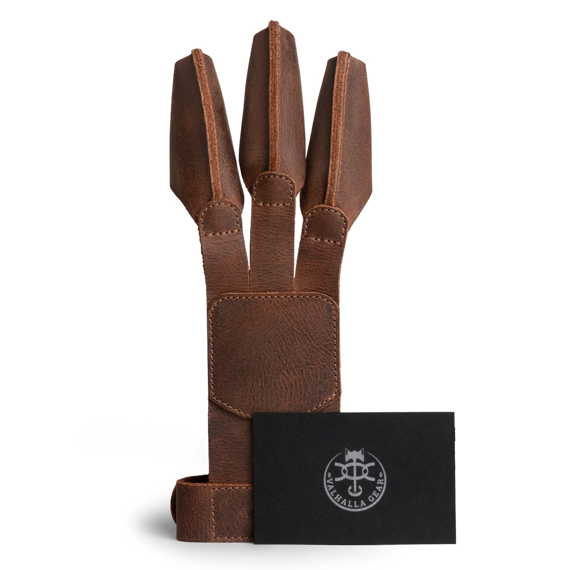 Valhalla Gear Rustic Three-Finger Archery Shooting Glove presented with branding cards, highlighting its artisan heritage and local craftsmanship. This glove, a perfect blend of function and style, is made from full grain leather for archery enthusiasts and artisans alike.