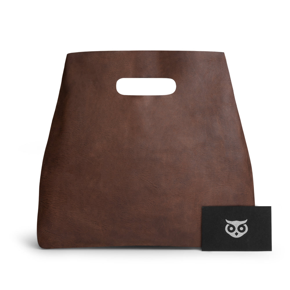 Hide & Drink Minimalist Boho Handbag with a business card, illustrating its elegant design and brand. This stylish minimalist handbag for women is perfect for any occasion, being artisan-made in La Antigua Guatemala & Oaxaca Mexico.