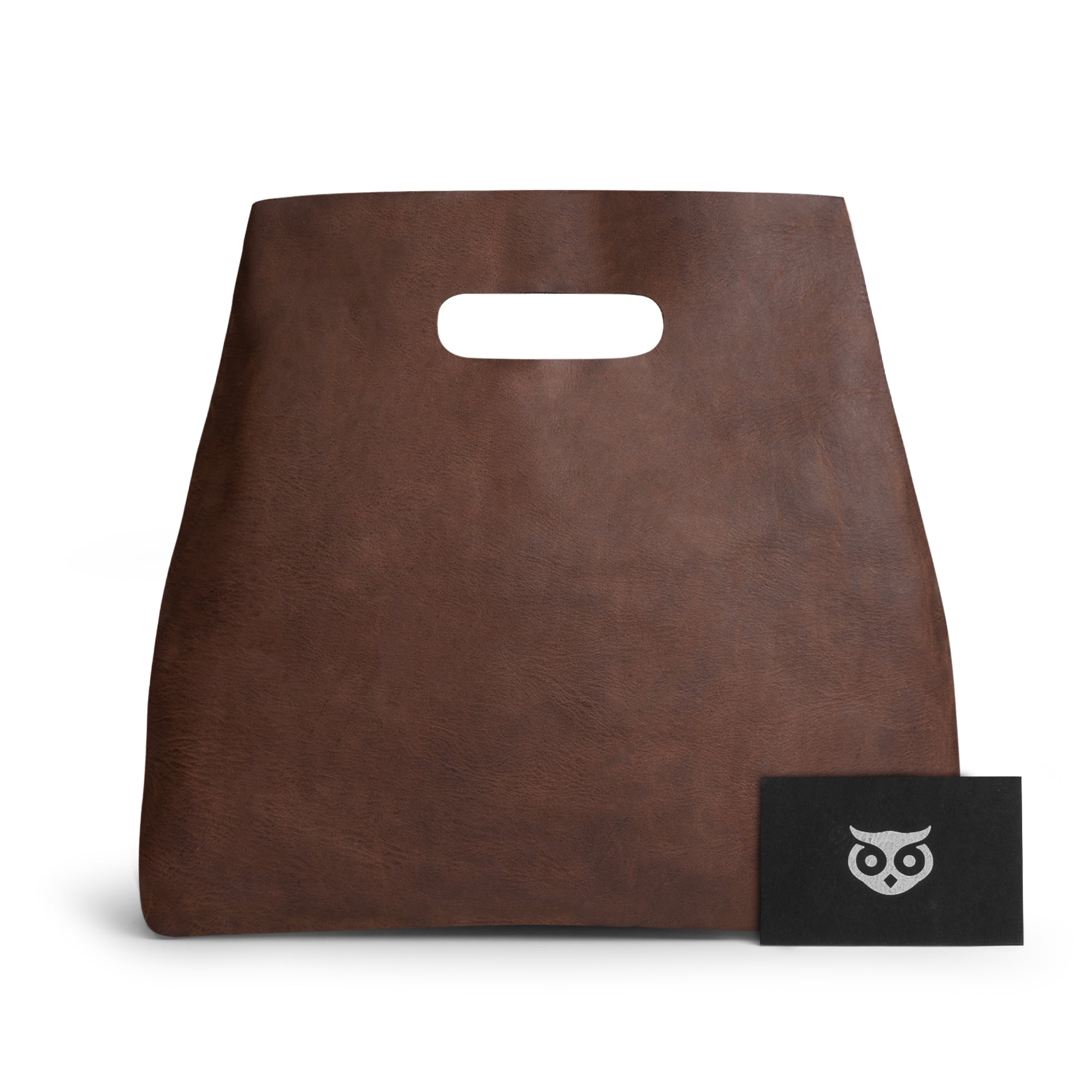 Hide & Drink Minimalist Boho Handbag with a business card, illustrating its elegant design and brand. This stylish minimalist handbag for women is perfect for any occasion, being artisan-made in La Antigua Guatemala & Oaxaca Mexico.