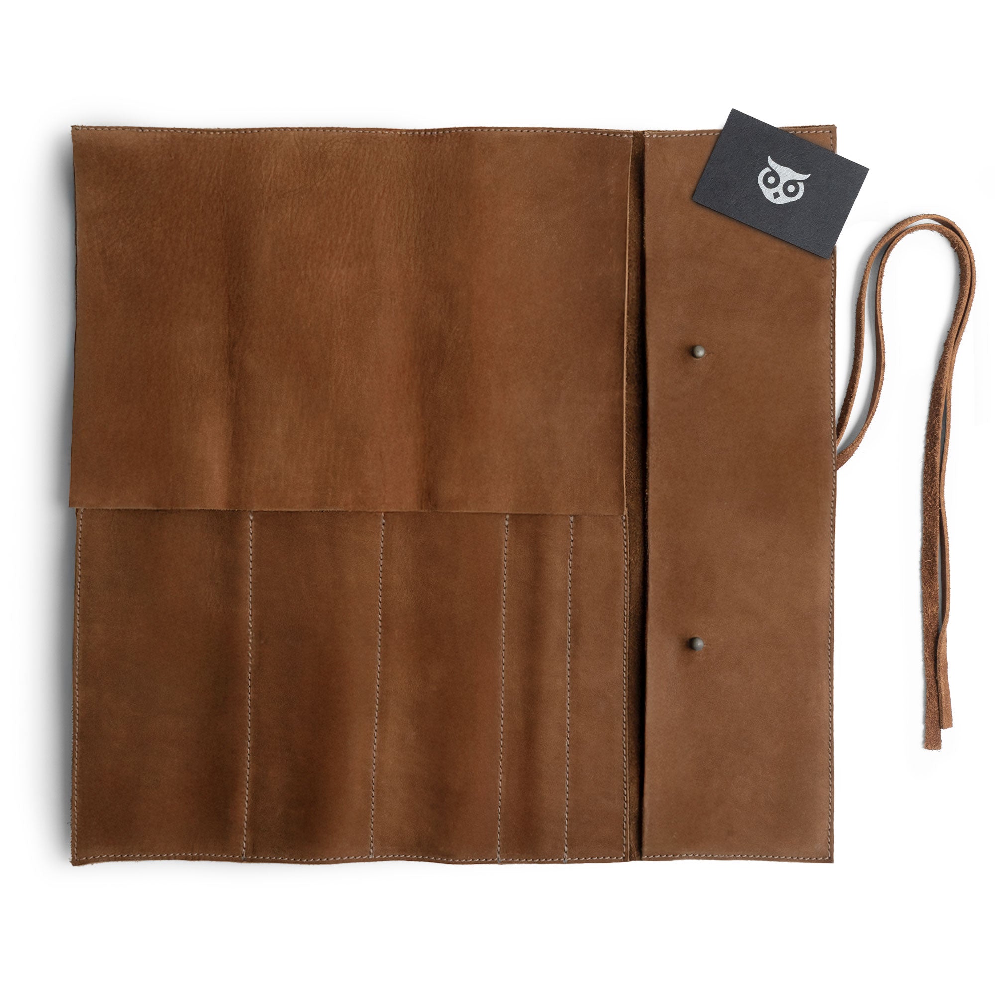 Hide & Drink Knife Roll (5 Pockets) neatly folded, beautifully made from Full Grain Leather. This Chef Knife Bag serves as a portable carrying case for knives, showcasing artisan skills with its handmade, small batch production, where each piece is hand cut and hand sewn.