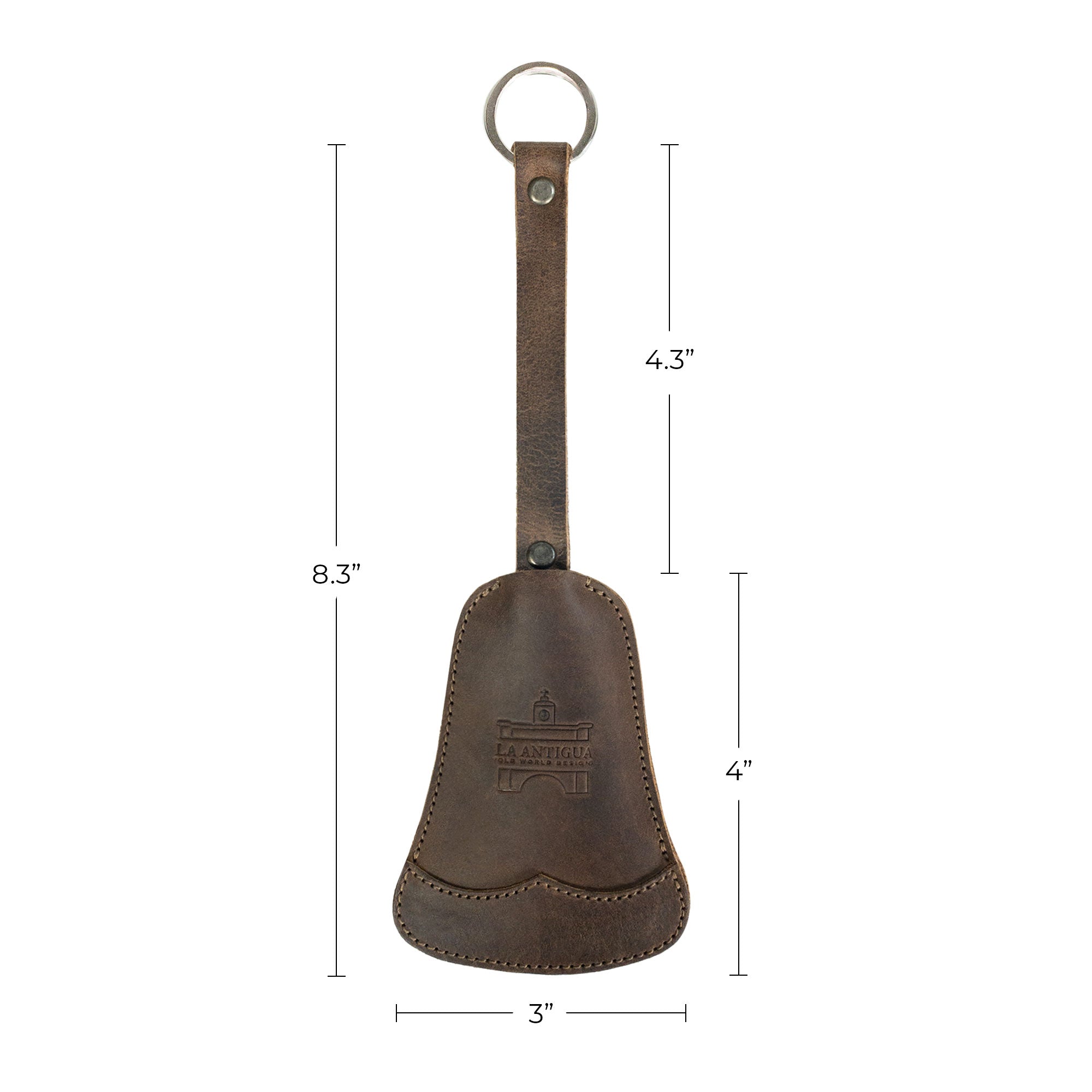 The Bell Shape Keychain from La Antigua alongside packaging and a tag, emphasizing its artisan quality as a keyring with strap. This key organizer provides easy attachment to keys while being made from fine full grain leather. This product highlights small batch production practices and is hand cut, hand sewn, and fire branded, handmade in La Antigua, Guatemala & Oaxaca, Mexico.