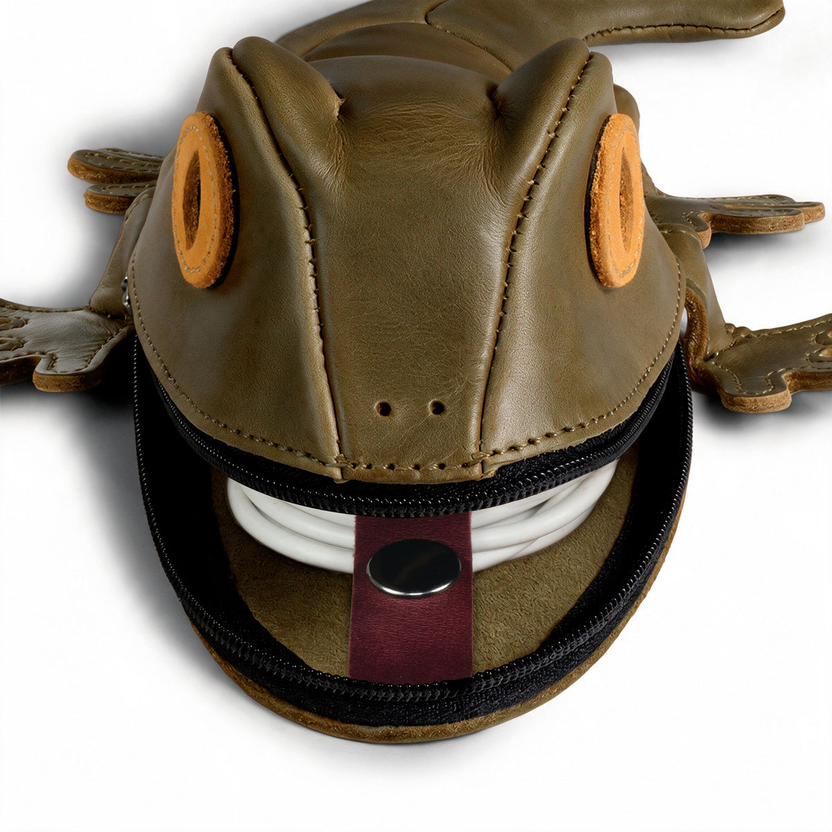 Close-up of the Tudi Frudi Gecko Pouch Gecko Pencil Pouch open with a charging cable inside, showing its Full Grain Leather Small Pen Organizer, Zippered Holder Wallet for Coins, Change Purse, Money Pouches for Men and Women, and Cable Holder design; StockyardX Small Batch Production, Hand Cut, Hand Sewn, Fire Branded Artisan craftsmanship, Handmade in La Antigua Guatemala & Oaxaca Mexico.