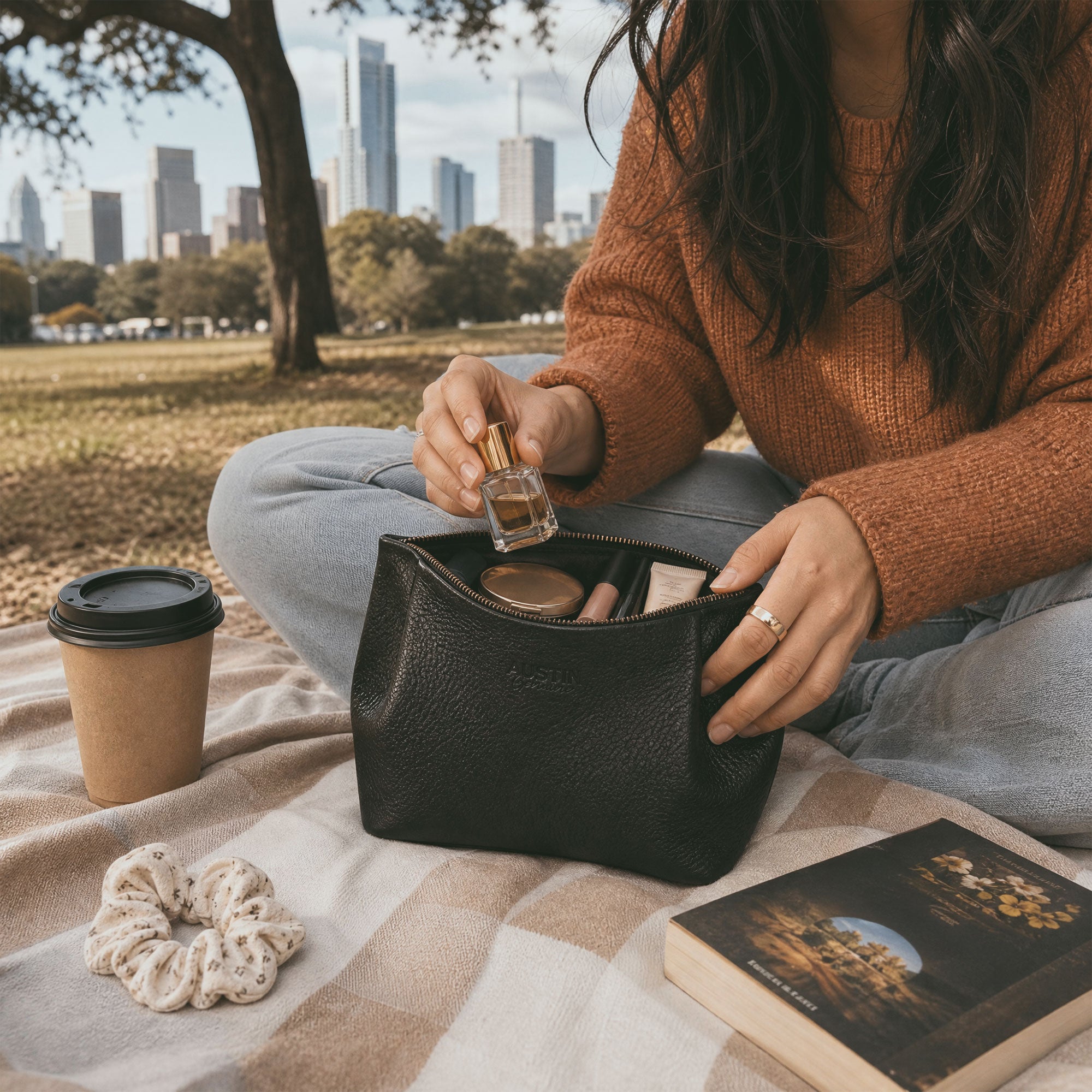 Austin Genuine The Kinney Beauty Bag black leather pouch shown with branded packaging, highlighting The Kinney Beauty Bag Full Grain Leather and StockyardX Small Batch Production with Hand Cut, Hand Sewn, Fire Branded, Artisan, Handmade in La Antigua Guatemala & Oaxaca Mexico craftsmanship.