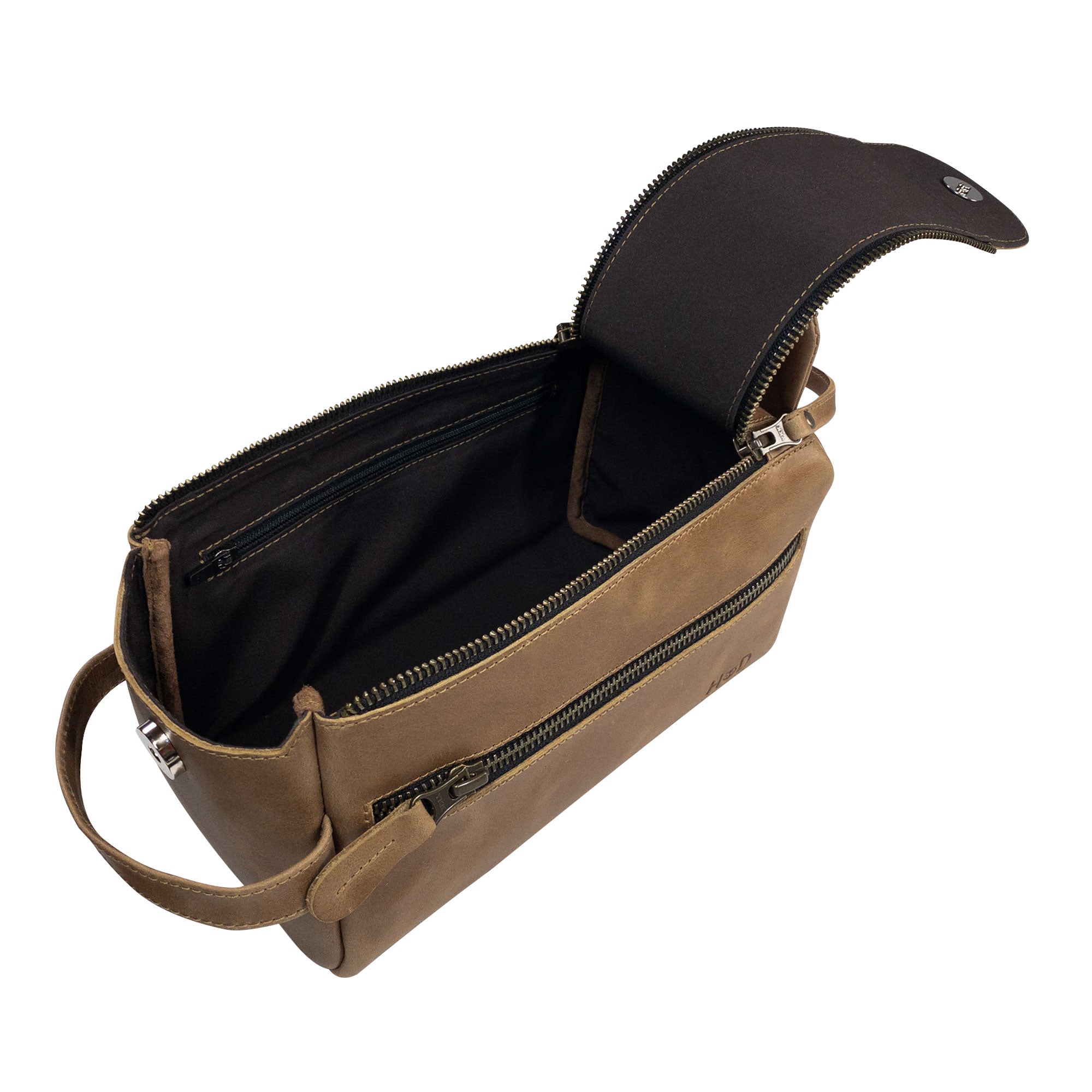 Close-up of Hide & Drink's Toiletry Bag showing its quality leather finish. This Full Grain Leather Toiletry Bag is a fashionable Hand Bag and convenient Dopp Kit Organizer for travel. StockyardX, Handmade, S.