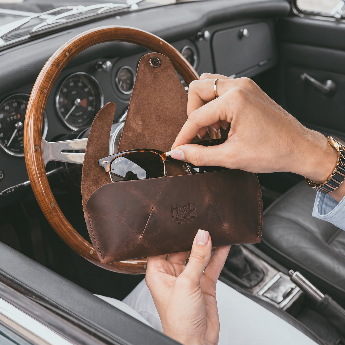 Side view of the Foldable Sunglass Case by Hide & Drink, showcasing its compact and foldable design. Crafted from durable Full Grain Leather, this case is a testament to small batch production and hand sewing.