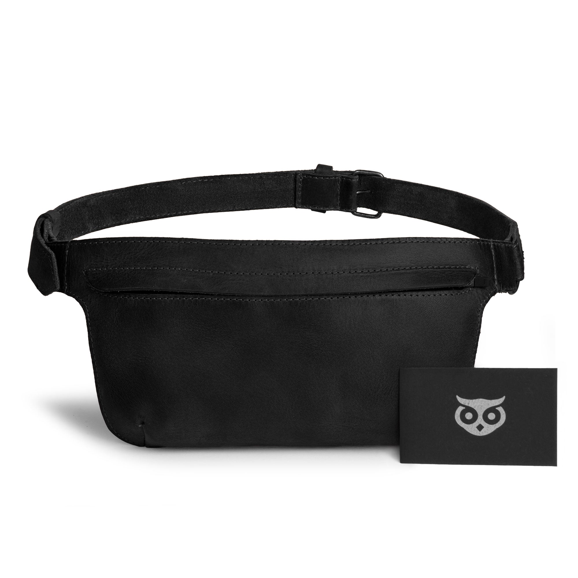 Slim Fanny Pack by Hide & Drink showcasing a black leather finish and front zip pocket, emphasizing its style as a functional phone holder. This artisan-crafted full grain leather accessory is handmade in La Antigua Guatemala.
