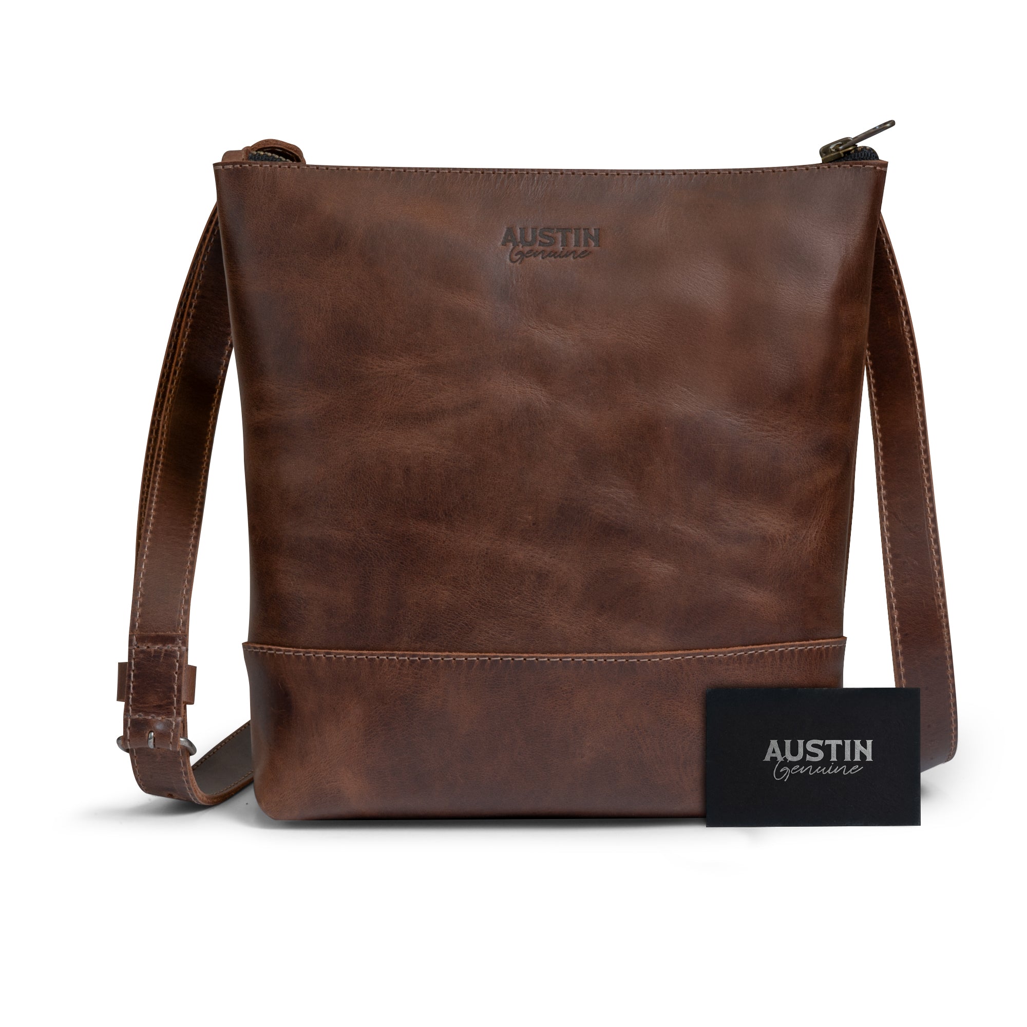 The Zilker Crossbody Bag by Austin Genuine, displaying its elegant design alongside a brand card, made from full grain leather, representing artisan craftsmanship and the vibrant culture of Austin, hand cut and sewn in La Antigua Guatemala & Oaxaca Mexico.