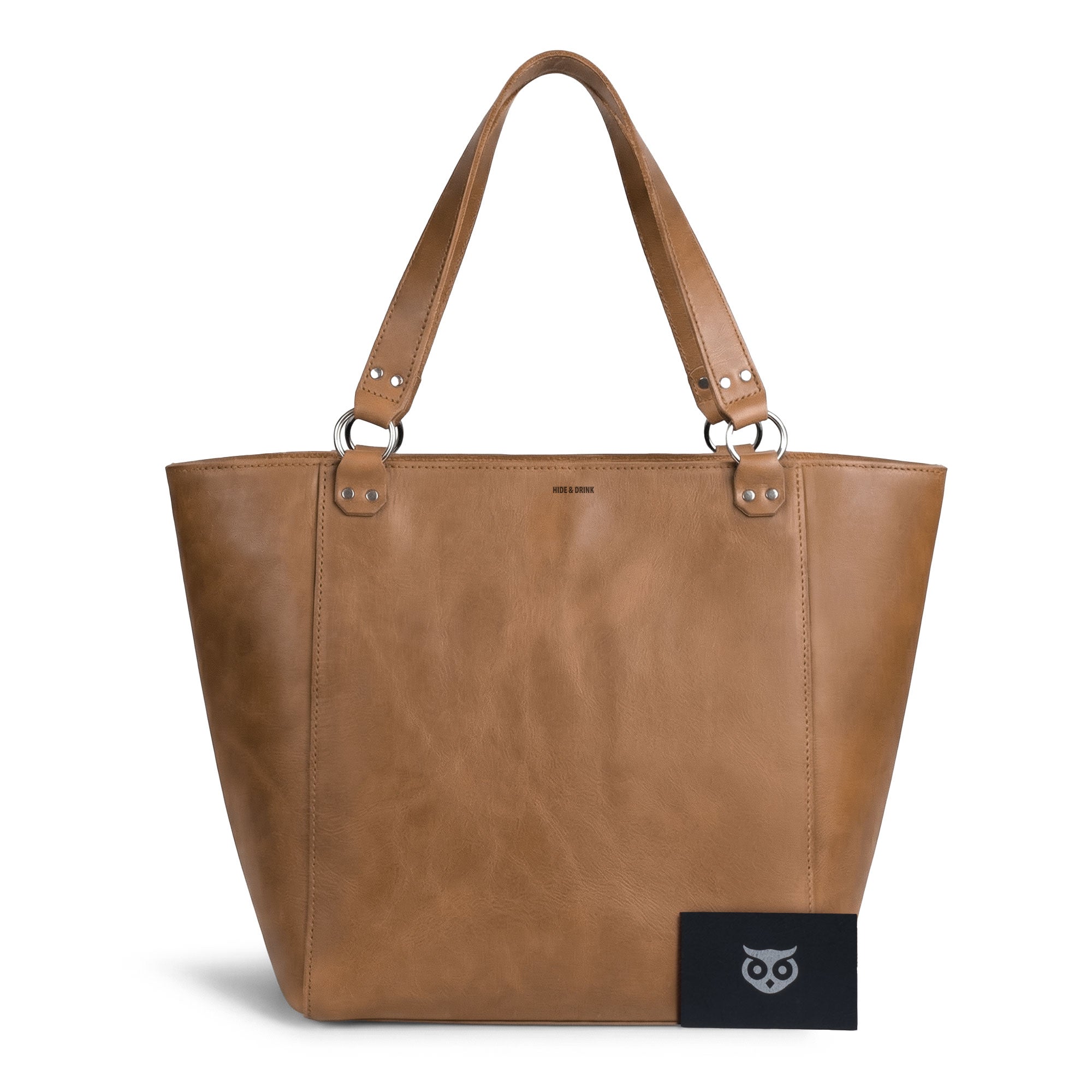Side view of the Leather Formal Handbag by Hide & Drink, showcasing its Full Grain Leather construction. This handmade artisan tote bag features a stylish design, ideal as a Female Formal Handbag, Shoulder Bag, or Shopping Bag, perfect for girls. Crafted in La Antigua Guatemala & Oaxaca Mexico.