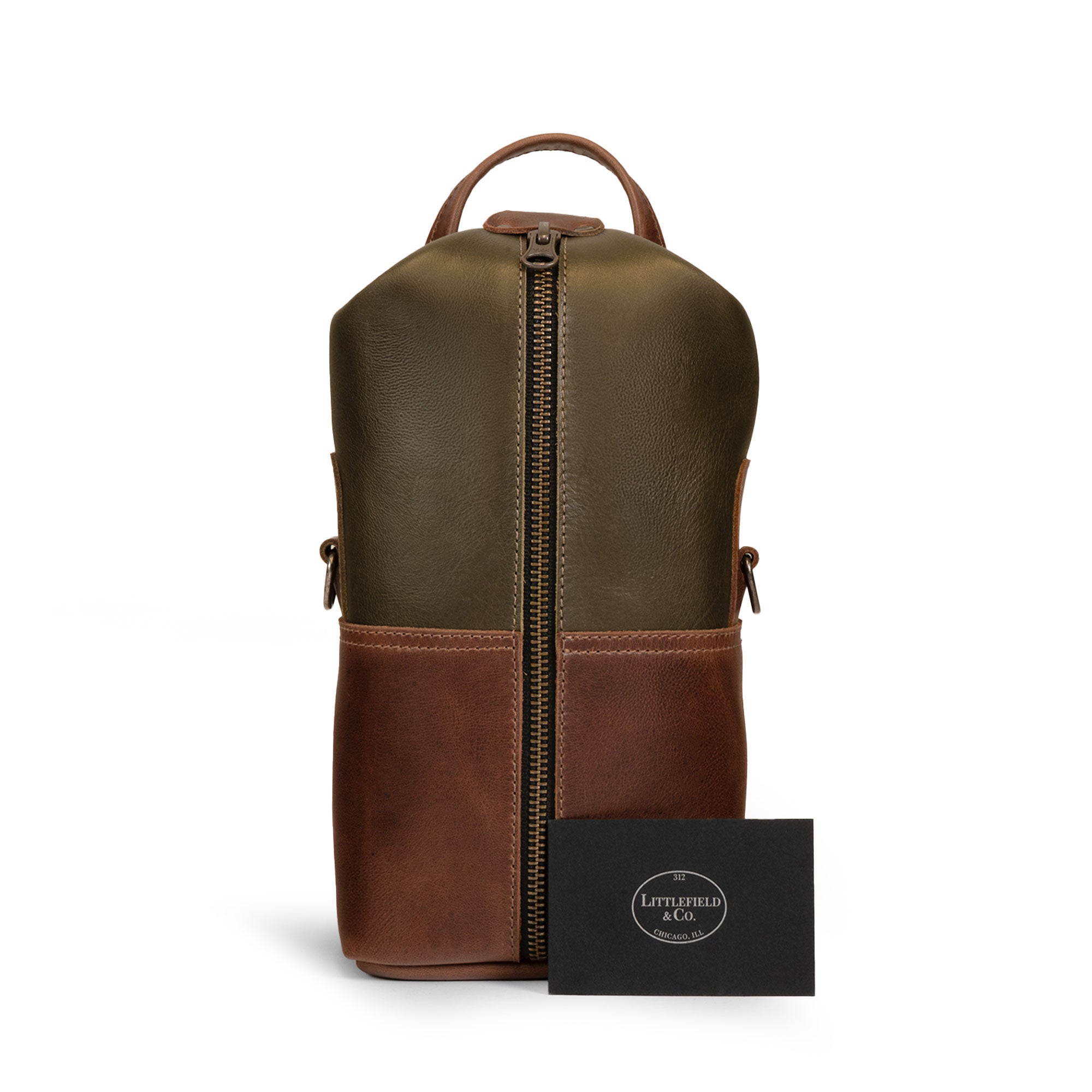 The Vintage Adventure Dopp Kit by Littlefield Chicago displayed alongside a travel setup, highlighting its versatility as a compact toiletries organizer for men, ideal for adventures and crafted with care in La Antigua Guatemala.