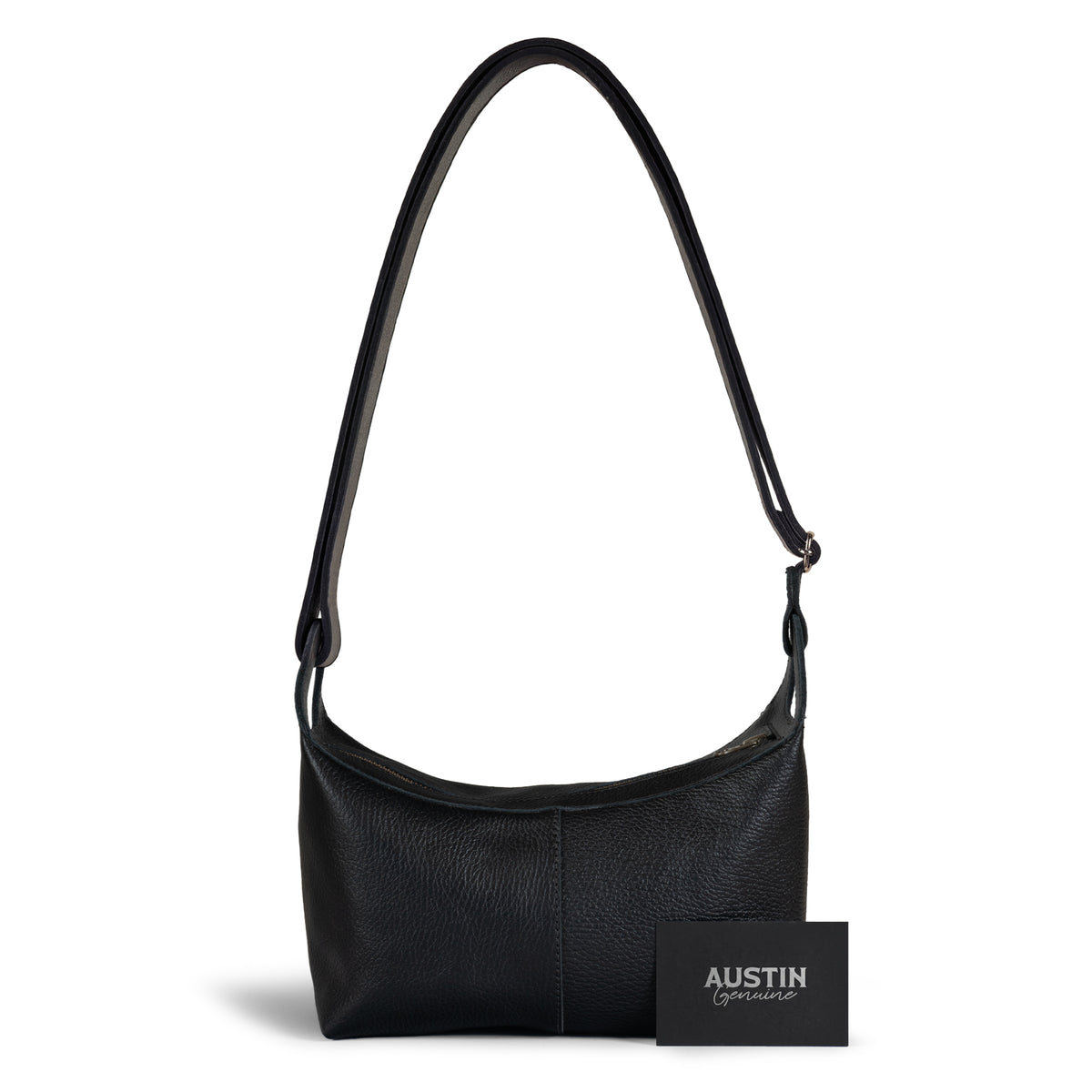 Austin Genuine The Mueller Hobo Shoulder Bag displayed beside a classic car, highlighting its black Full Grain Leather, relaxed shoulder design, and StockyardX Artisan character from Small Batch Production, Hand Cut, Hand Sewn, Fire Branded craftsmanship, Handmade in La Antigua Guatemala & Oaxaca Mexico.