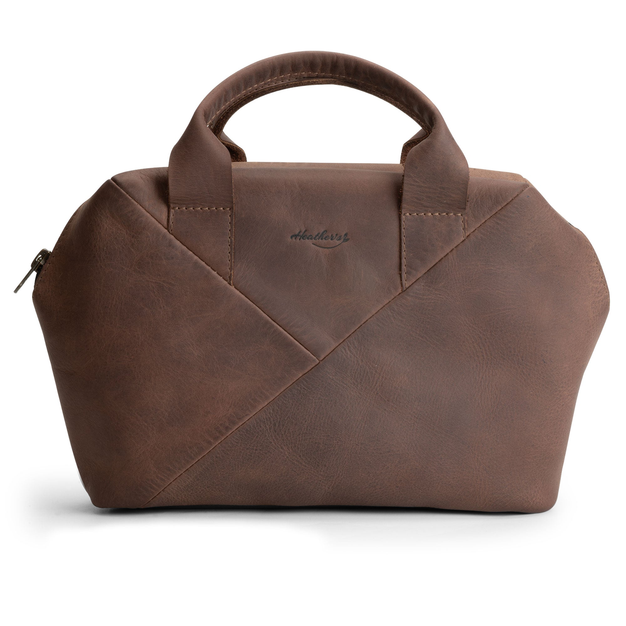 Heather's Fluffy Purse made of Full Grain Leather, showcasing its stylish design. This Leather Fluffy Purse serves as a Handbag for Women perfect for a night out, a Rectangular Purse with Zipper for essentials, and a Travel Make Up Bag. Artisan-made through Small Batch Production, this bag features Hand Cut and Hand Sewn elements, Fire Branded for authenticity, and is Handmade in La Antigua Guatemala & Oaxaca Mexico.