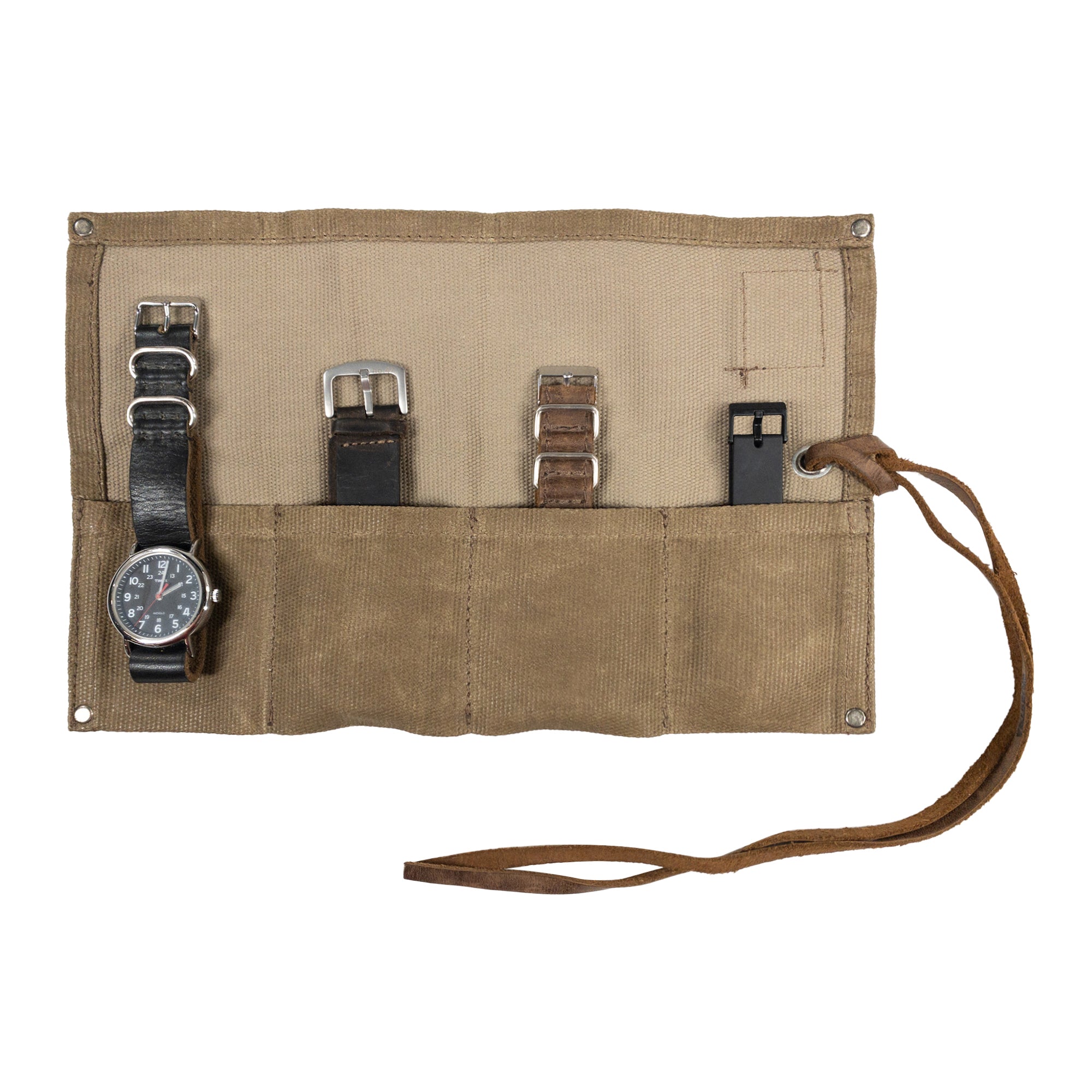 The Waxed Canvas Watch Roll by Hide & Drink, a handmade organizer, holds up to 4 watches. This artisan piece is designed for easy carrying and stylish storage, crafted in La Antigua Guatemala and Oaxaca, Mexico.