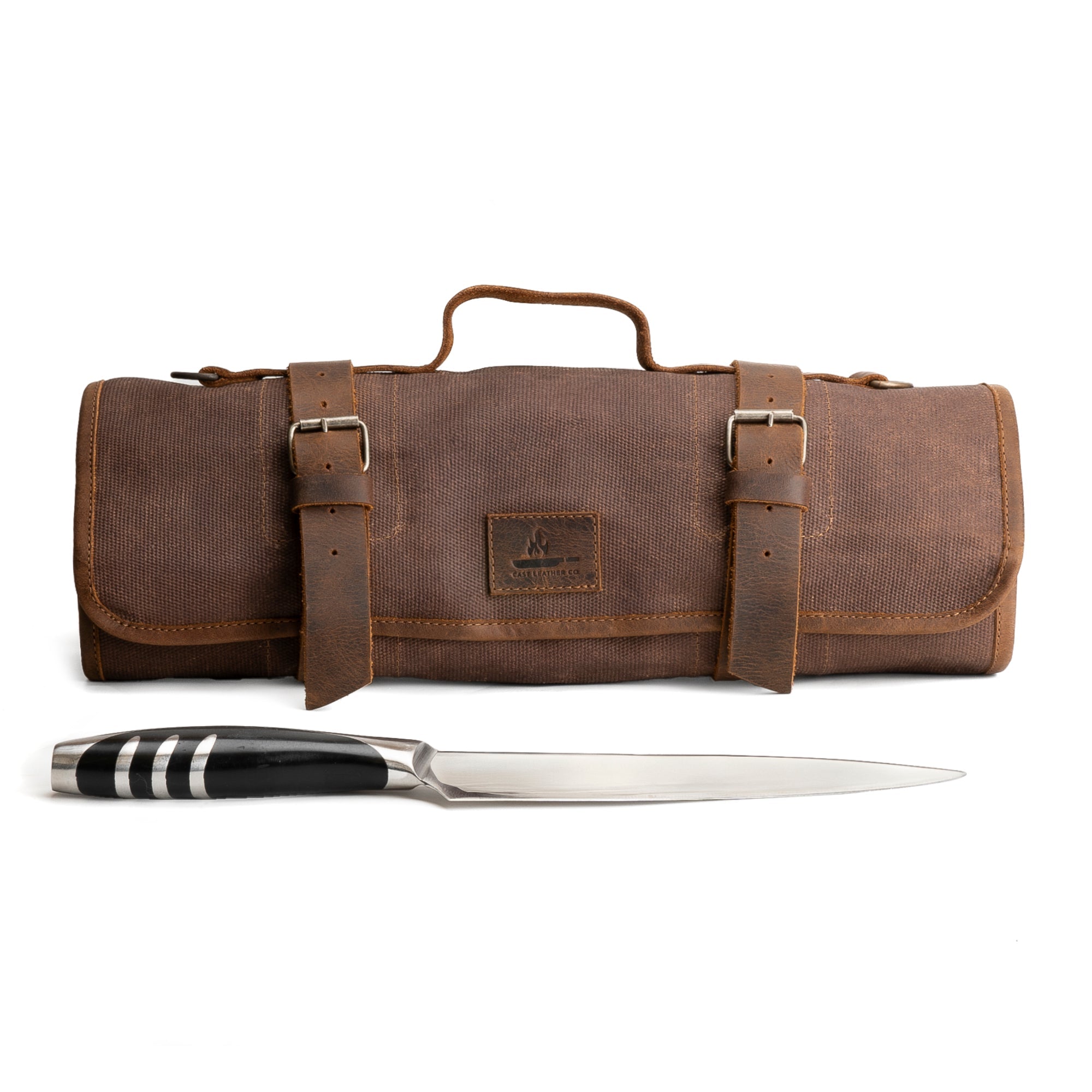 A stylish Knife Roll with 8 Slots by Cast Leather Co., showcasing a rugged exterior made of waxed canvas and full grain leather. Ideal for organizing knives and cooking accessories on the go, this portable knife organizer is perfect for chefs and home cooks alike. Handmade in La Antigua Guatemala, it features small batch production methods, hand-cut and hand-sewn details, and a fire branded logo.