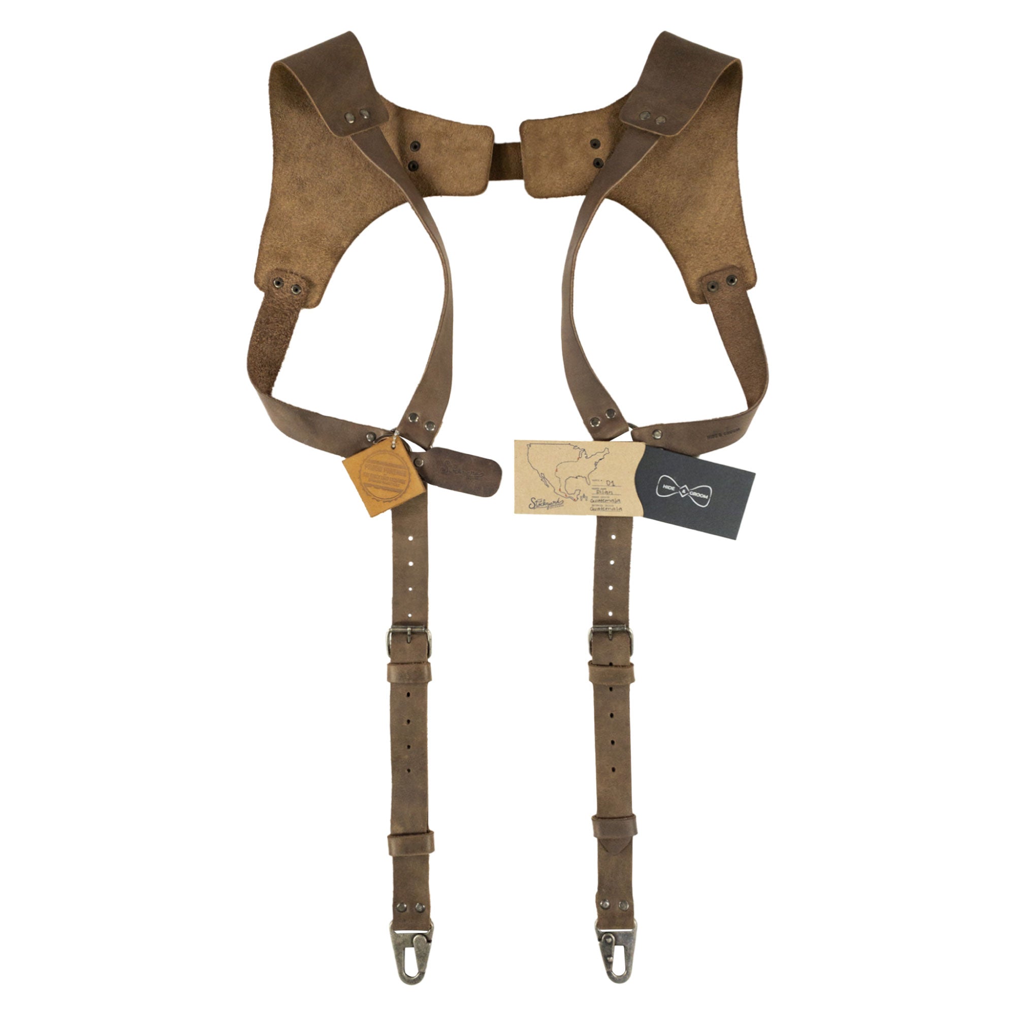 Styled display of Vintage Renaissance Suspenders by Hide & Groom, highlighting the combination of full grain leather and metal hooks. These handmade suspenders make a perfect addition to any steampunk wardrobe.