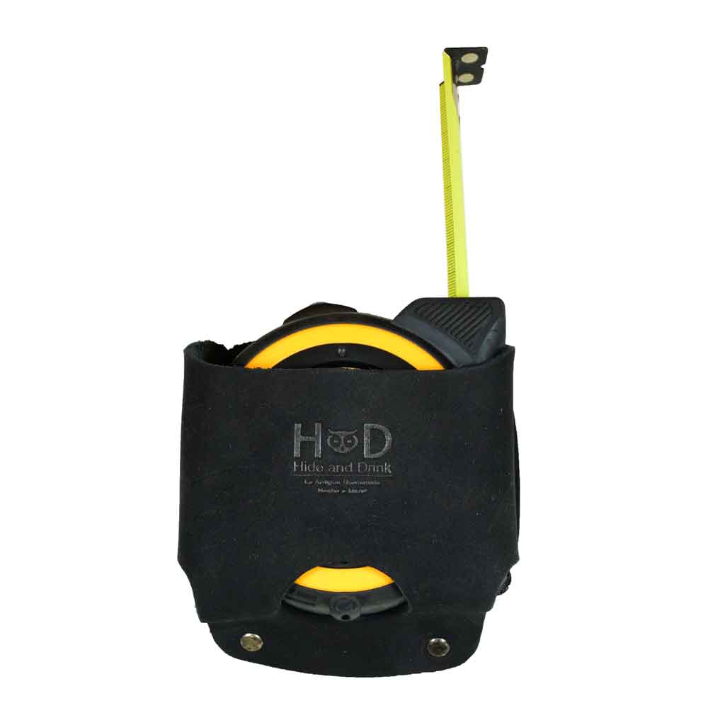Durable Large Tape Holster by Hide & Drink featured in sleek black, designed for practicality and style. This artisan-made tool holster holds a Large Tape Measure securely, crafted in La Antigua Guatemala.