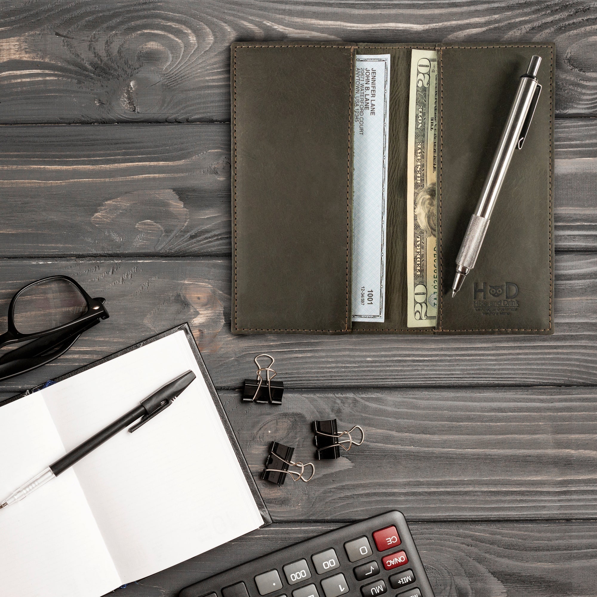 Checkbook Leather Cover by Hide & Drink in an elegant style, designed as a minimalist organizer for standard checkbooks. This artisan product, crafted from full grain leather, is handmade in La Antigua Guatemala and Oaxaca Mexico, highlighting techniques of small batch production.