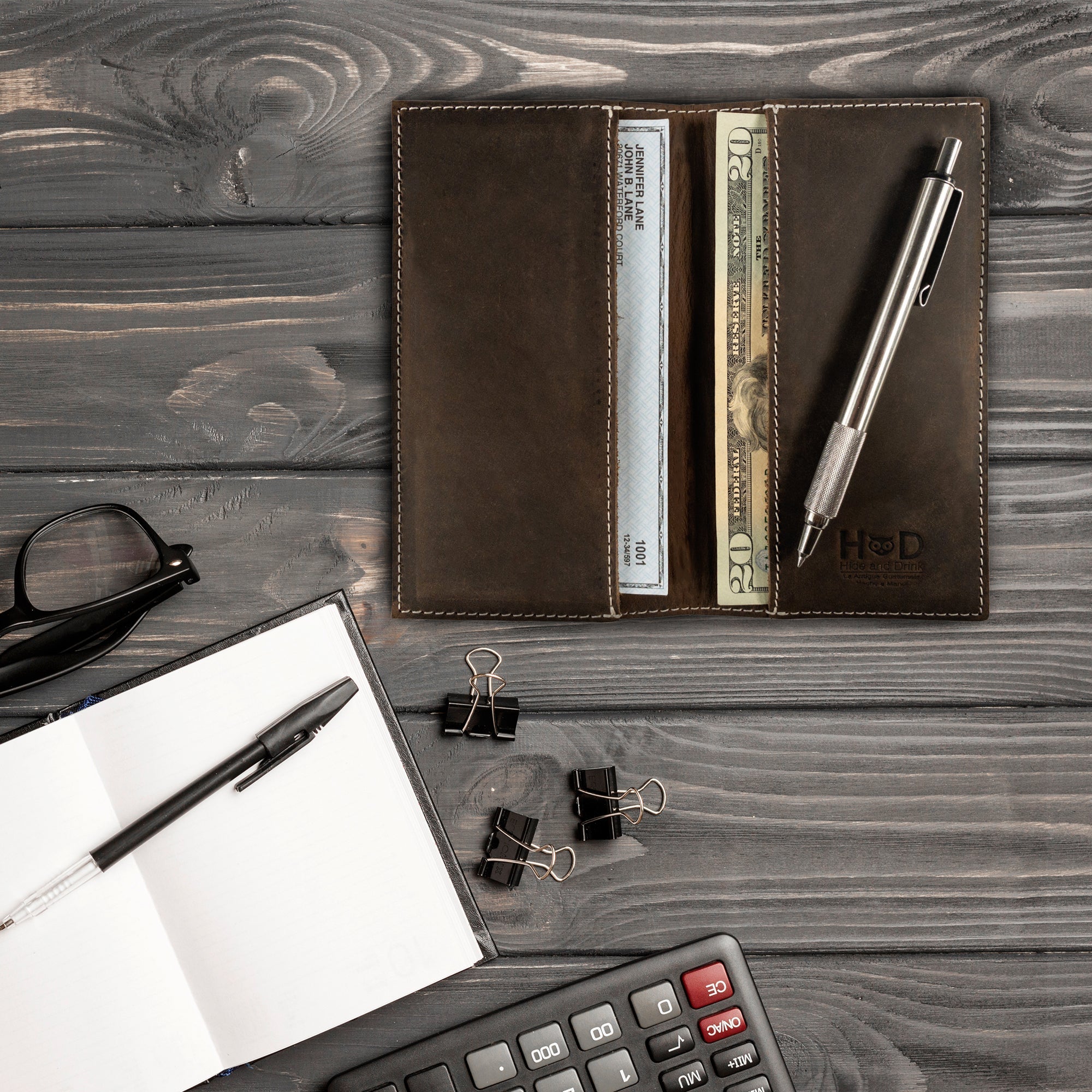 Dimensions of the Checkbook Leather Cover by Hide & Drink in vibrant colors, ideal for use as a minimalist organizer for standard checkbooks. This handmade item reflects artisan techniques involved in small batch production in La Antigua Guatemala and Oaxaca Mexico.