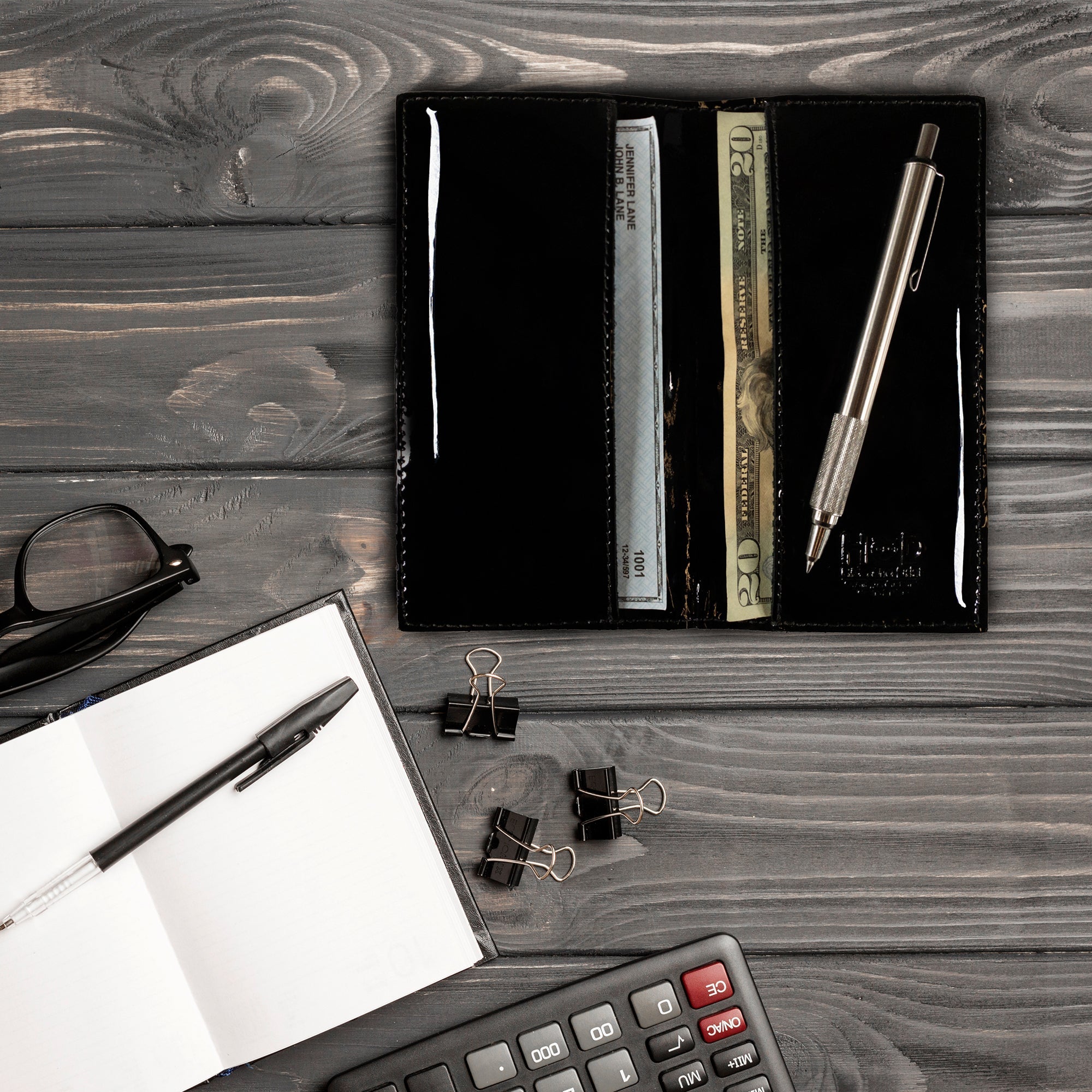 Inside view of the Checkbook Leather Cover by Hide & Drink, showcasing its versatility as a minimalist organizer for standard checkbooks. This artisan item is handmade from full grain leather, reflecting the commitment to small batch production in La Antigua Guatemala and Oaxaca Mexico.