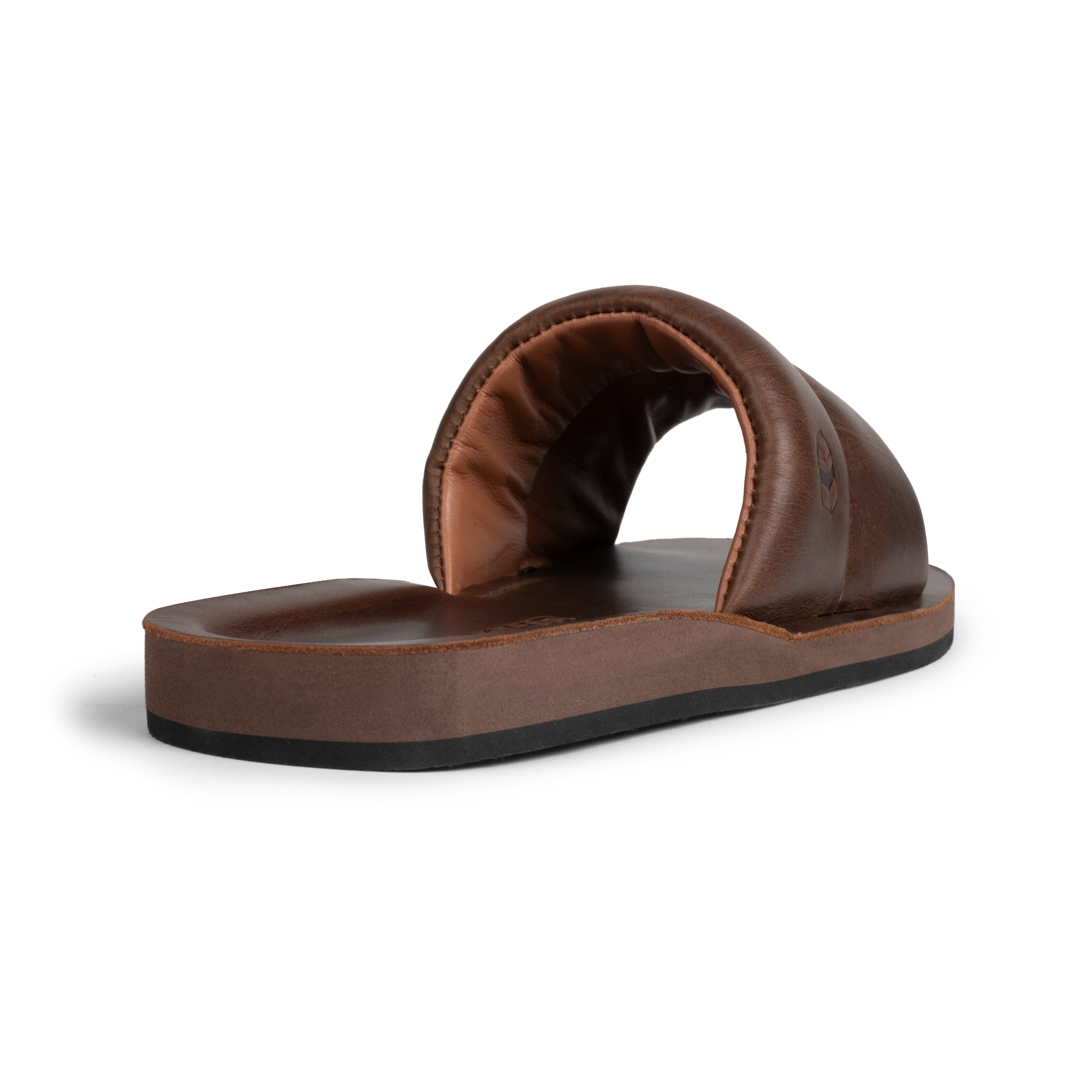 Back view of The Bayside Leather Slide from StockyardX, highlighting its unique and comfortable design. This bayside sandal is made from premium full grain leather ensuring durability and elegance. Hand cut, hand sewn, and artisan-made in La Antigua Guatemala & Oaxaca Mexico, it offers lifestyle comfort.