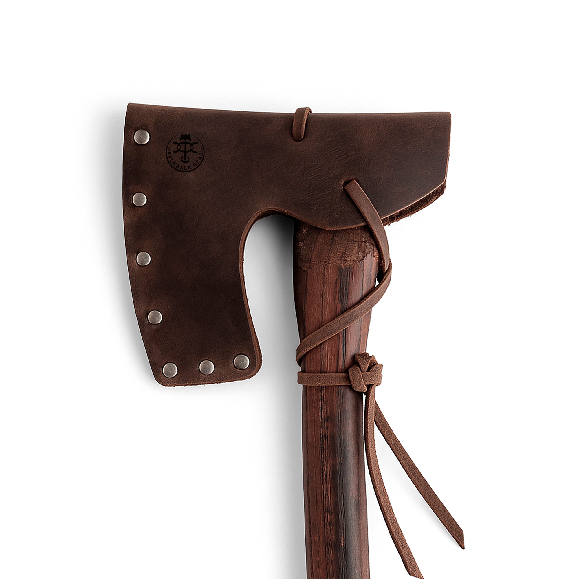 Valhalla Gear Bearded Axe Head Sheath with String displayed on a wooden axe, showcasing the craftsmanship of the Riveted Axe Head Sheath with String, a durable Protector Case made from Full Grain Leather, perfect for Lumberjack and Camping Accessories. This artisan product is handmade in La Antigua Guatemala & Oaxaca Mexico, reflecting Small Batch Production techniques with Hand Cut and Hand Sewn elements.