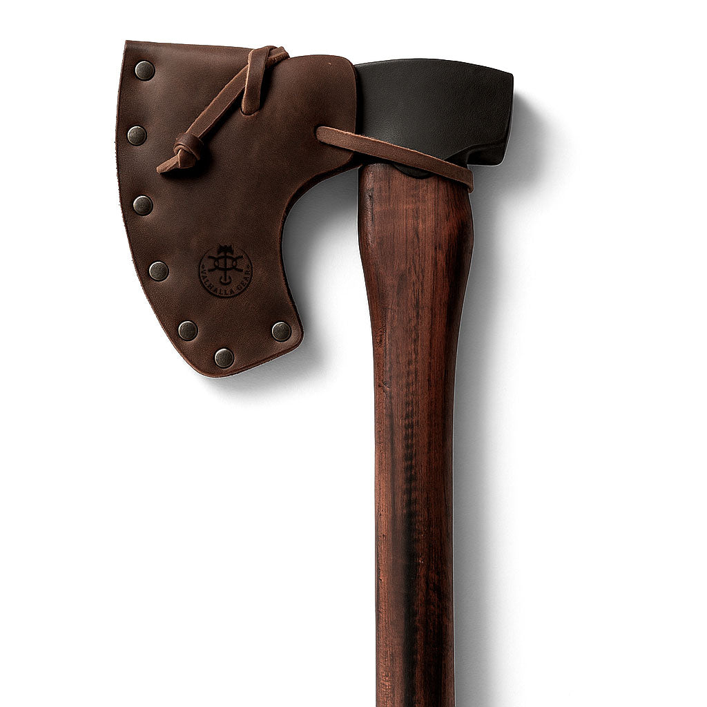 The Axe Head Sheath with String by Valhalla Gear showcases a full grain leather design, ideal for outdoor enthusiasts. This artisan-made sheath is part of a small batch production in La Antigua Guatemala, embodying durability and style. It's perfect for your hatchet and complements any motorcycle tool bag.