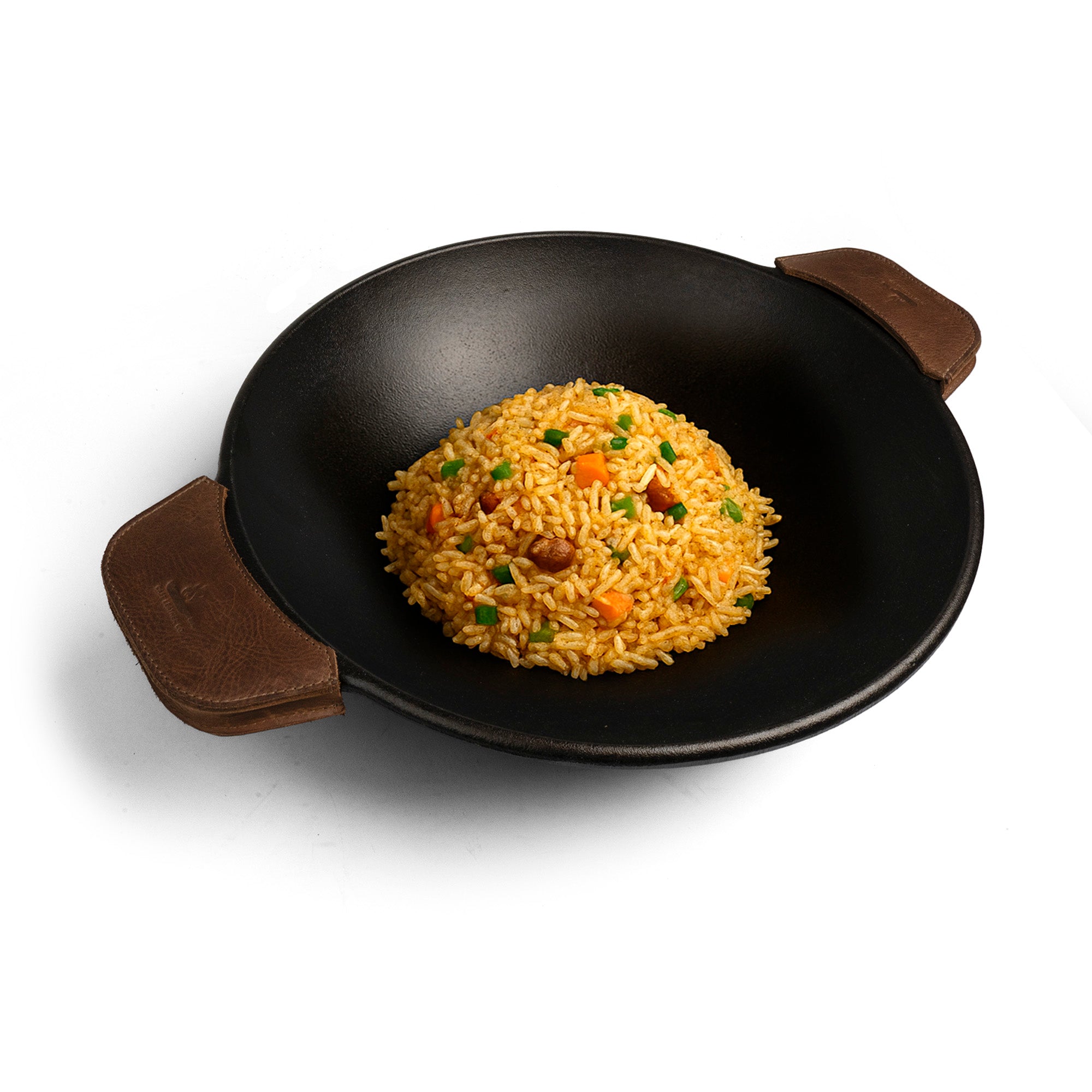 Delicious stir-fried rice in a wok, featuring the Wok Sidekick by Cast Leather Co. as a cooking accessory with rustic leather handles. Made of full grain leather, this set of 2 handle covers for wok is artisan-made in La Antigua Guatemala and Oaxaca Mexico, showcasing small batch production and hand cut craftsmanship.