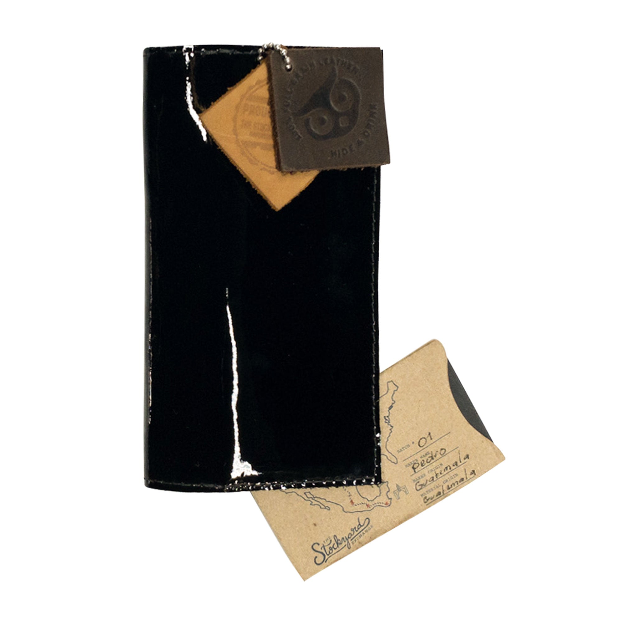 Checkbook Leather Cover by Hide & Drink featuring a bold design, functioning as a minimalist organizer for standard checkbooks. This artisan product is handmade from full grain leather in La Antigua Guatemala and Oaxaca Mexico, emphasizing small batch production techniques.