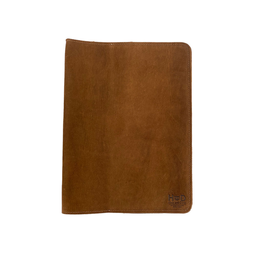 Open view of the vintage leather Full Grain Leather Journal Cover for Moleskine Cahier XL (7.5 x 9.75 in.) by Hide & Drink, featuring beautiful interior designs and a bookmark. The perfect journal case for those who value handcrafted quality.