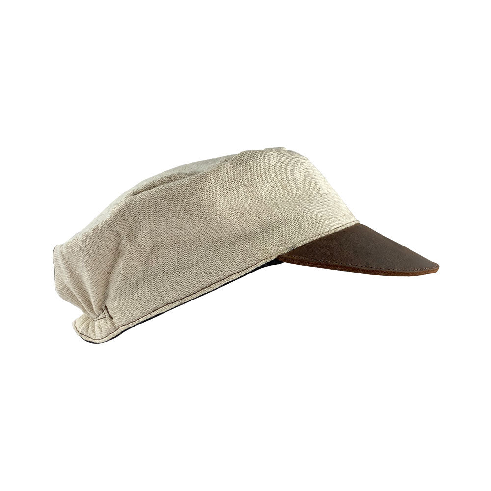 Side view of the Manta Cotton Painter Cap by Hide & Drink, showcasing its unique design made from Full Grain Leather & Natural Manta Cotton, perfect for artists. This Canvas Painter Cap features small batch production, is hand cut, hand sewn, and fire branded, representing artisan craftsmanship made in La Antigua Guatemala & Oaxaca Mexico.