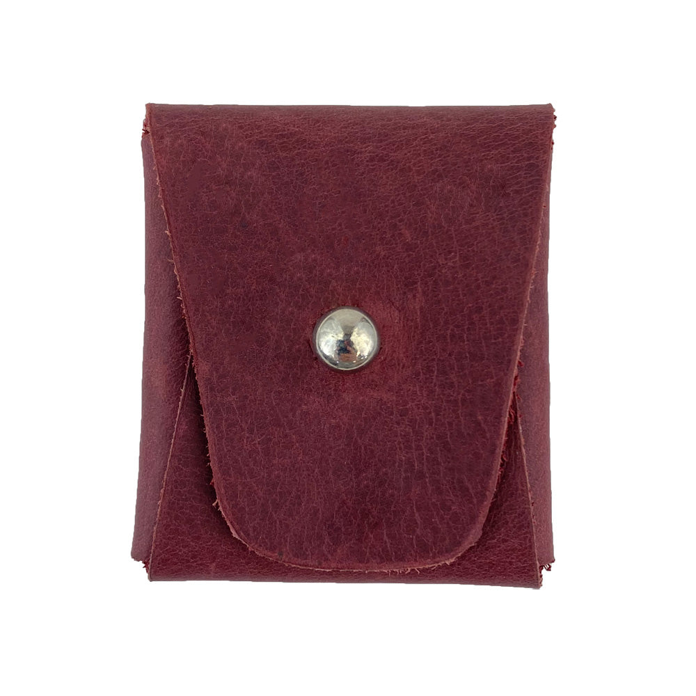 Front view of a burgundy Minimalist Square Coin Pouch by Hide & Drink, crafted from rugged full grain leather. This compact pouch offers a beautiful design perfect for storing coins and small essentials while emphasizing minimalist features. Minimalist Coin Pouch, SD Card Holder, Wallet and Cash Organizer, Full Grain Leather, StockyardX, Small Batch Production, Hand Cut, Hand Sewn, Fire Branded, Artisan, Handmade in La Antigua Guatemala & Oaxaca Mexico.
