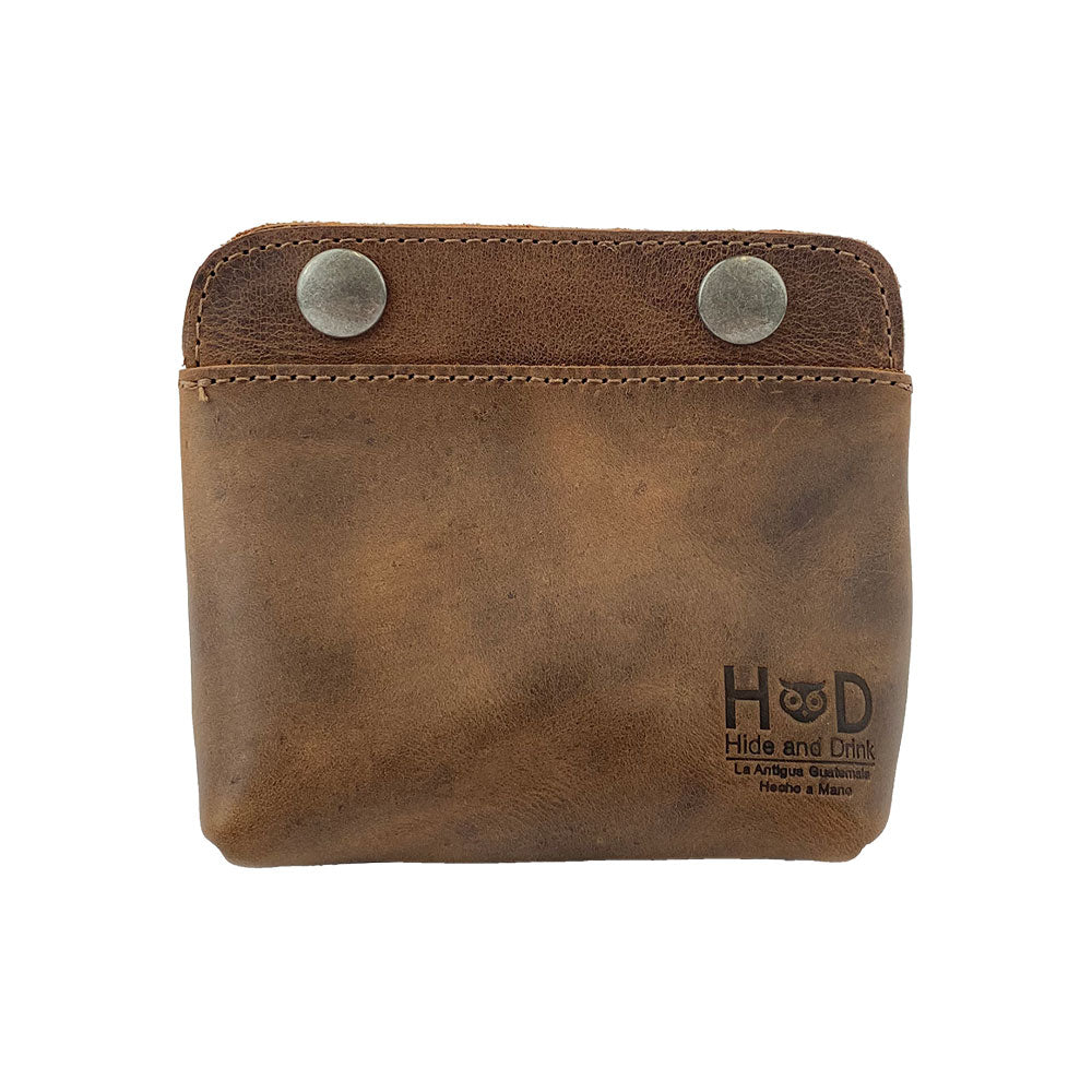 Hide & Drink Double Snap Pouch made of full grain leather, ideal as a coin purse, cash & card holder, or small cable organizer. This artisan handmade product from La Antigua Guatemala showcases the craftsmanship of small batch production, being hand cut, hand sewn, and fire branded.