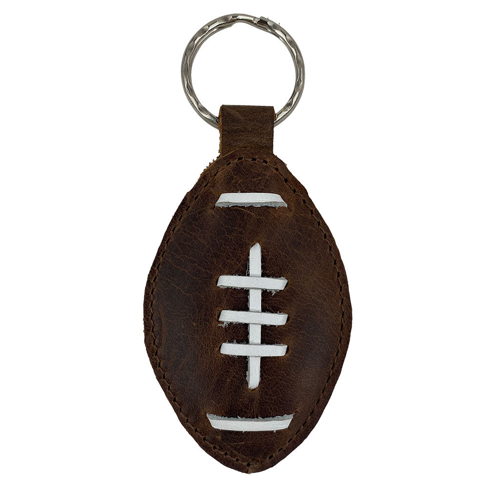 Stylish Football Key Chain made from Full Grain Leather by Hide & Drink, showcasing handcrafted details and a unique artisan design. Perfect for sports fans, featuring tags Football Keychain, Small Batch Production, Hand Cut, Hand Sewn, Fire Branded, Artisan, Handmade in La Antigua Guatemala & Oaxaca Mexico.