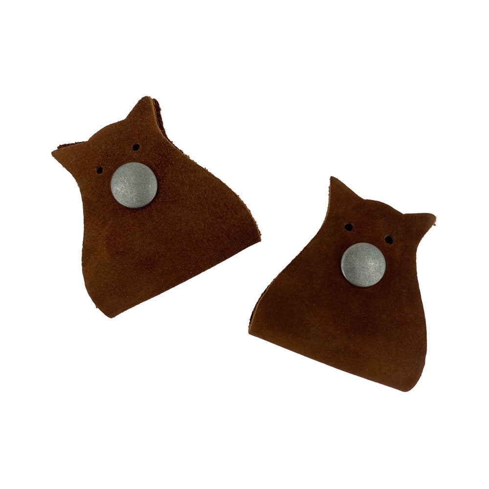 Owl Shaped Cord Keeper (2-Pack) by Hide & Drink featuring two owl-shaped cord organizers made of full grain leather. Owl Shaped Cord Keeper (Cord Clam) 2-Pack. Full Grain Leather, StockyardX, Small Batch Production, Hand Cut, Hand Sewn, Fire Branded, Artisan, Handmade in La Antigua Guatemala & Oaxaca Mexico.