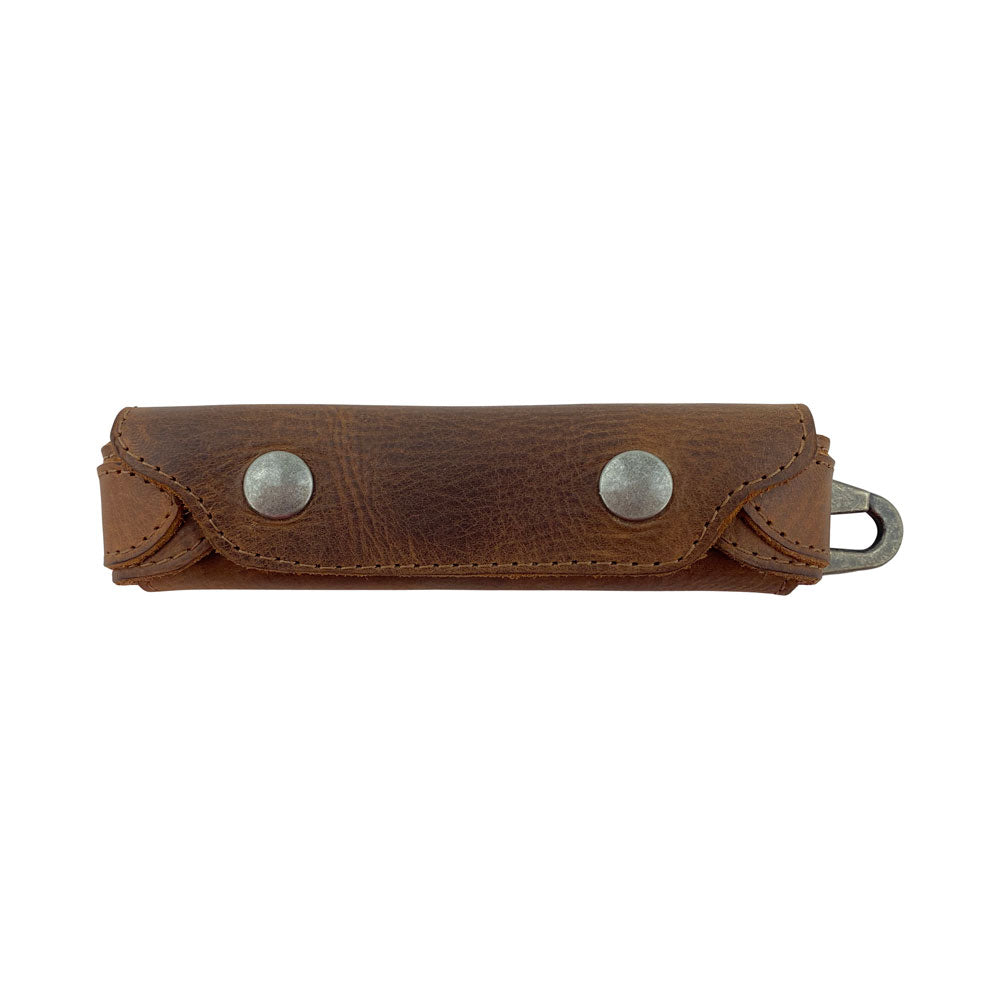 Stylish Harmonica Case from Hide & Drink, showcasing a vintage style protector made from full grain leather. Perfect for musicians, this expertly crafted instrument cover is a handmade piece from La Antigua Guatemala. Ideal for protecting your harmonica with the small batch production quality and artisan craftsmanship.
