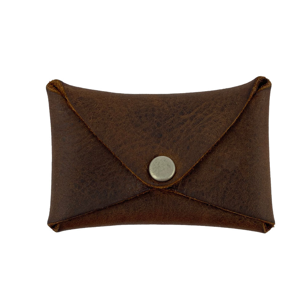 Hide & Drink Envelope Coin Case featuring rustic leather in an envelope shape, perfect for storing coins. This artisan-crafted item showcases full grain leather and is handmade in La Antigua Guatemala & Oaxaca Mexico, reflecting small batch production principles.