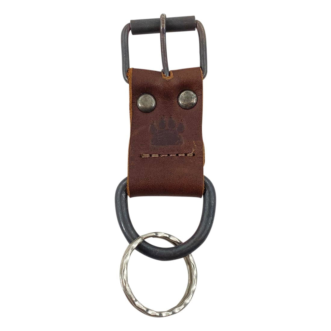 Taco Dog's Dog Collar Keychain featuring a rustic brown full grain leather design, a stylish and durable lightweight accessory perfect for keeping keys organized. This handmade keychain is an ideal gift for any dog lover, showcasing small batch production techniques with hand cut and sewn craftsmanship in La Antigua Guatemala & Oaxaca Mexico.