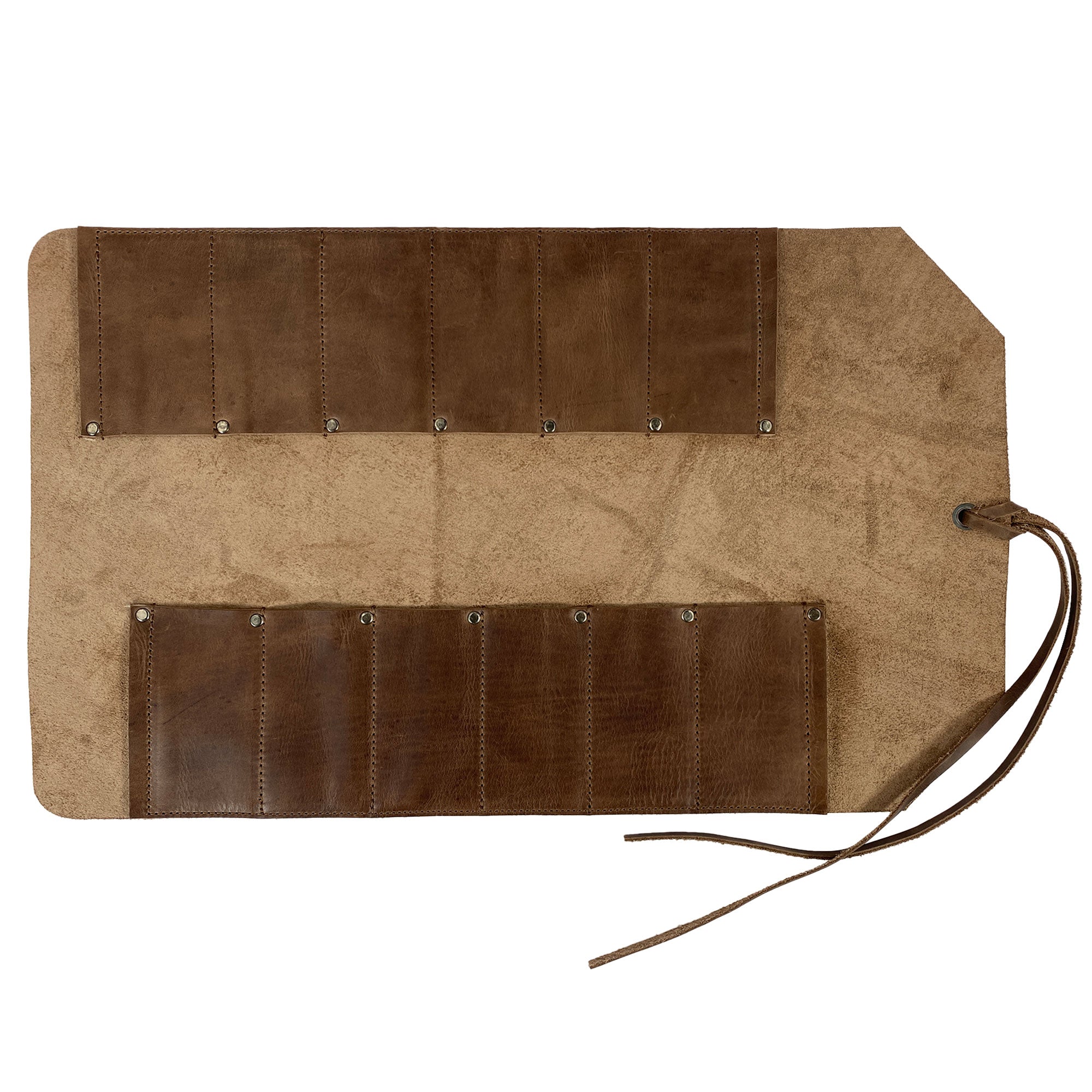 The 12 Pocket Tool Roll - Home Storage by Heavy Duty Hide, featuring 12 slots for tools, made of durable Full Grain Leather. Ideal for woodworking tools organization and portable storage. This Big Tool Roll Up Bag, hand cut and sewn in La Antigua Guatemala, showcases vintage style and artisan craftsmanship.